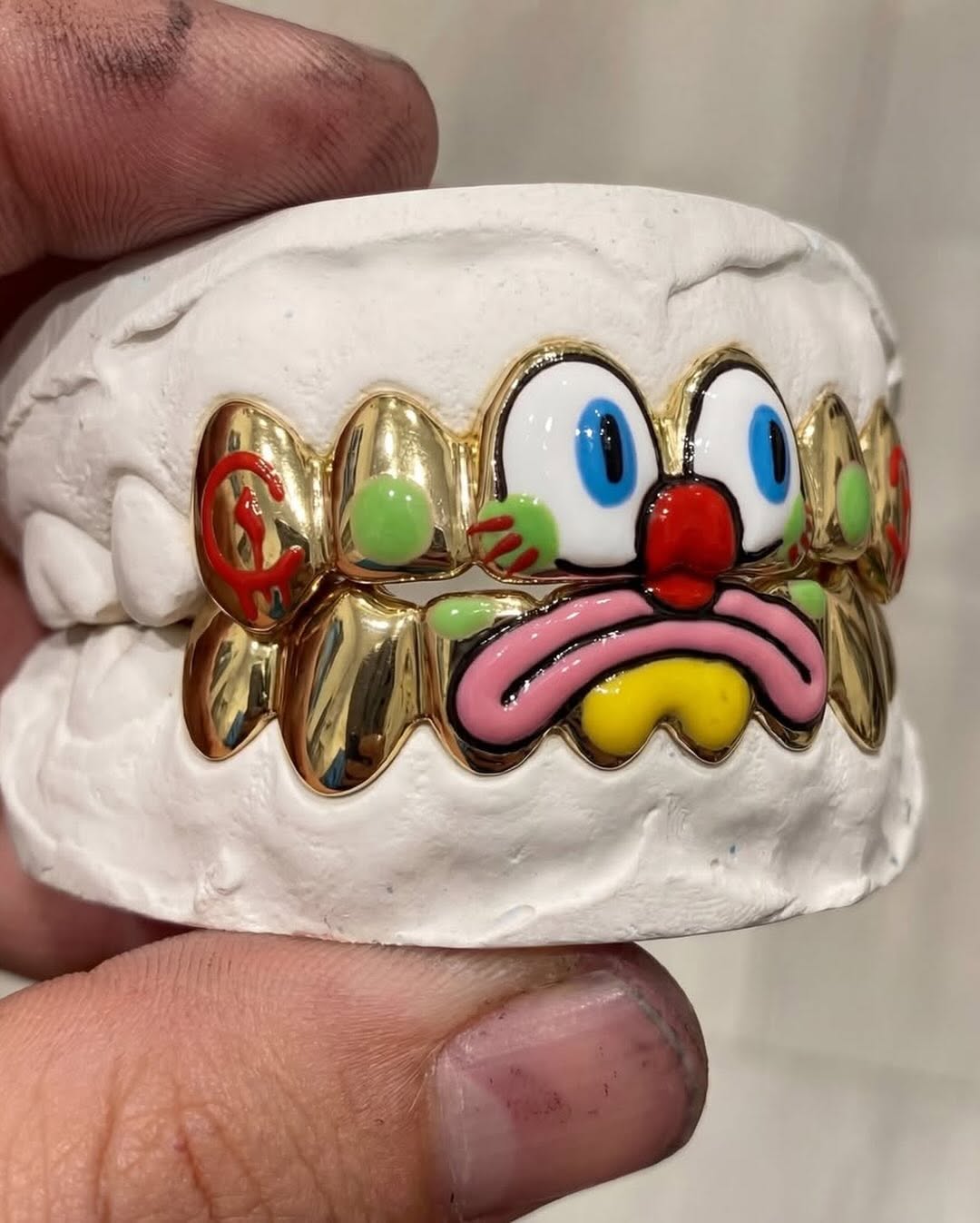 OLAOLUSLAWN TRANSFORMS GRILLZ INTO FINE ART WITH KABIL COLLABORATION