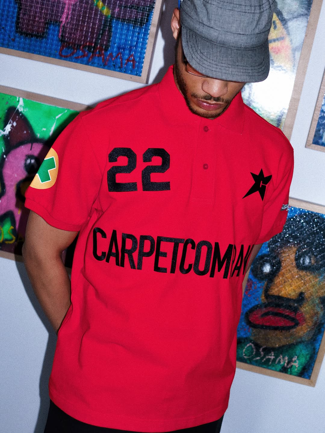 Carpet Company Season 22 pique cotton polo shirts laid flat showing embroidered and screen-printed graphics