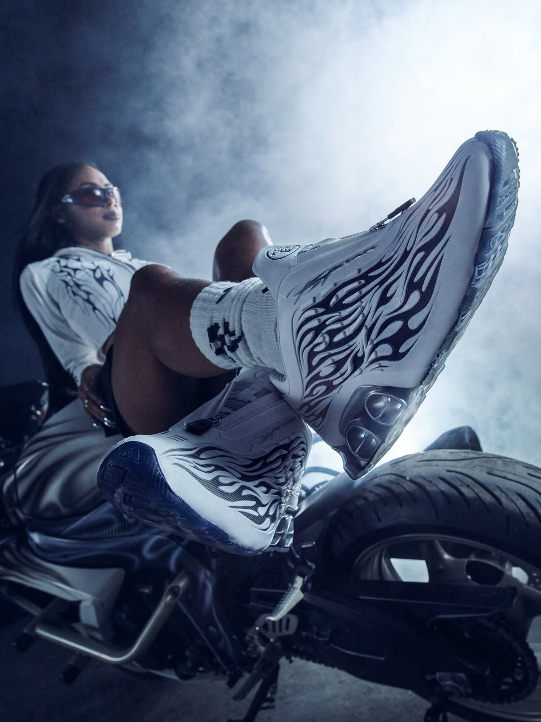 The adidas x Hellstar Megaride S2 sneaker in off white leather with black flame graphics embossed across the side panels.