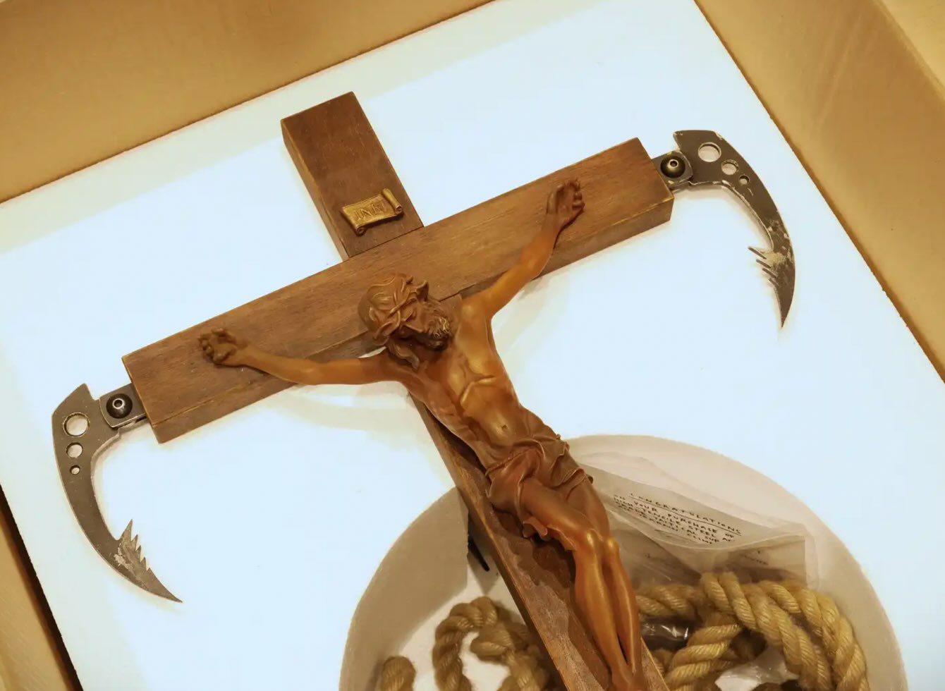 Banksy's Grappling Hook sculpture with its original box, listed as auction lot 22 of 26.