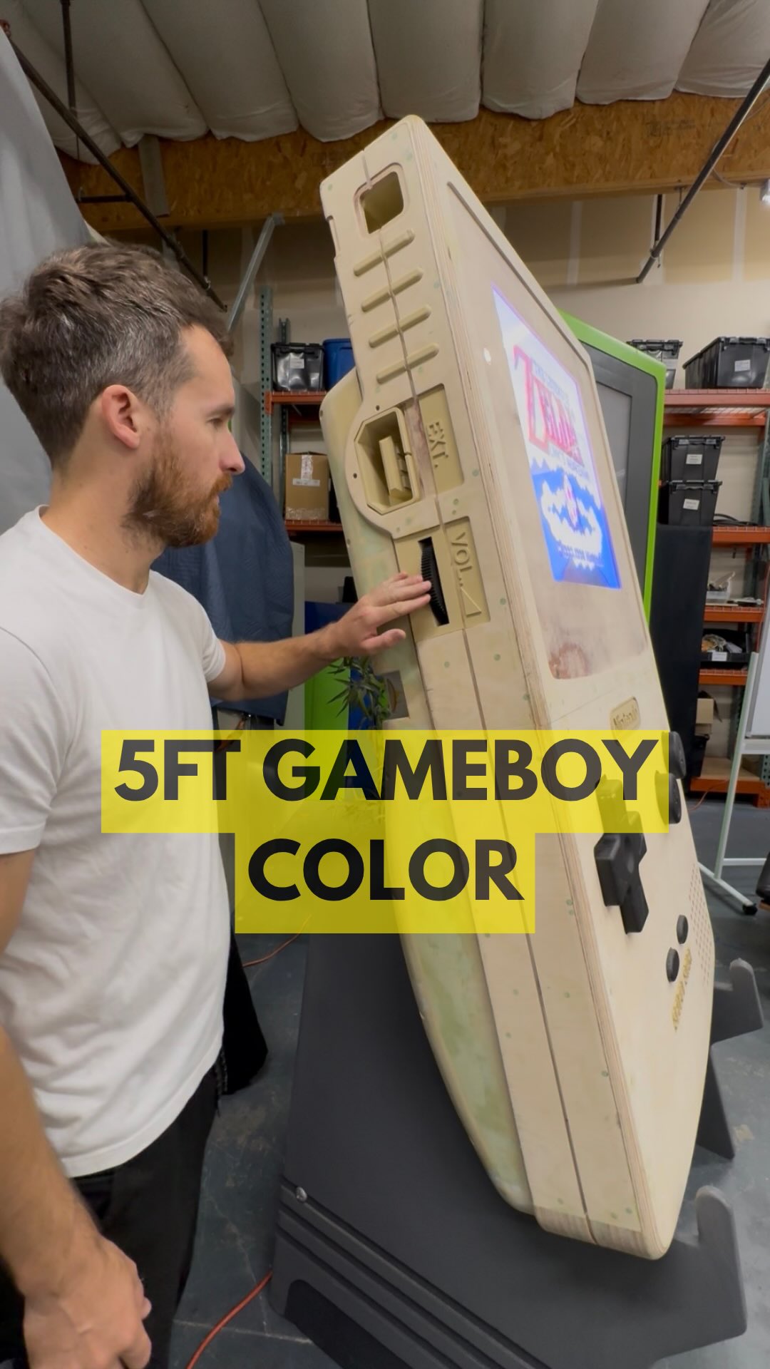 A giant, five foot tall Game Boy Color build by maker Nickbuildstuff and P.POW Creative, tagged to Zelda and Nintendo.