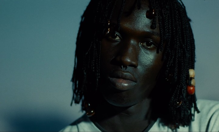 A still from Denim Tears' Tears fragrance campaign film, credited to director Dexter Navy.