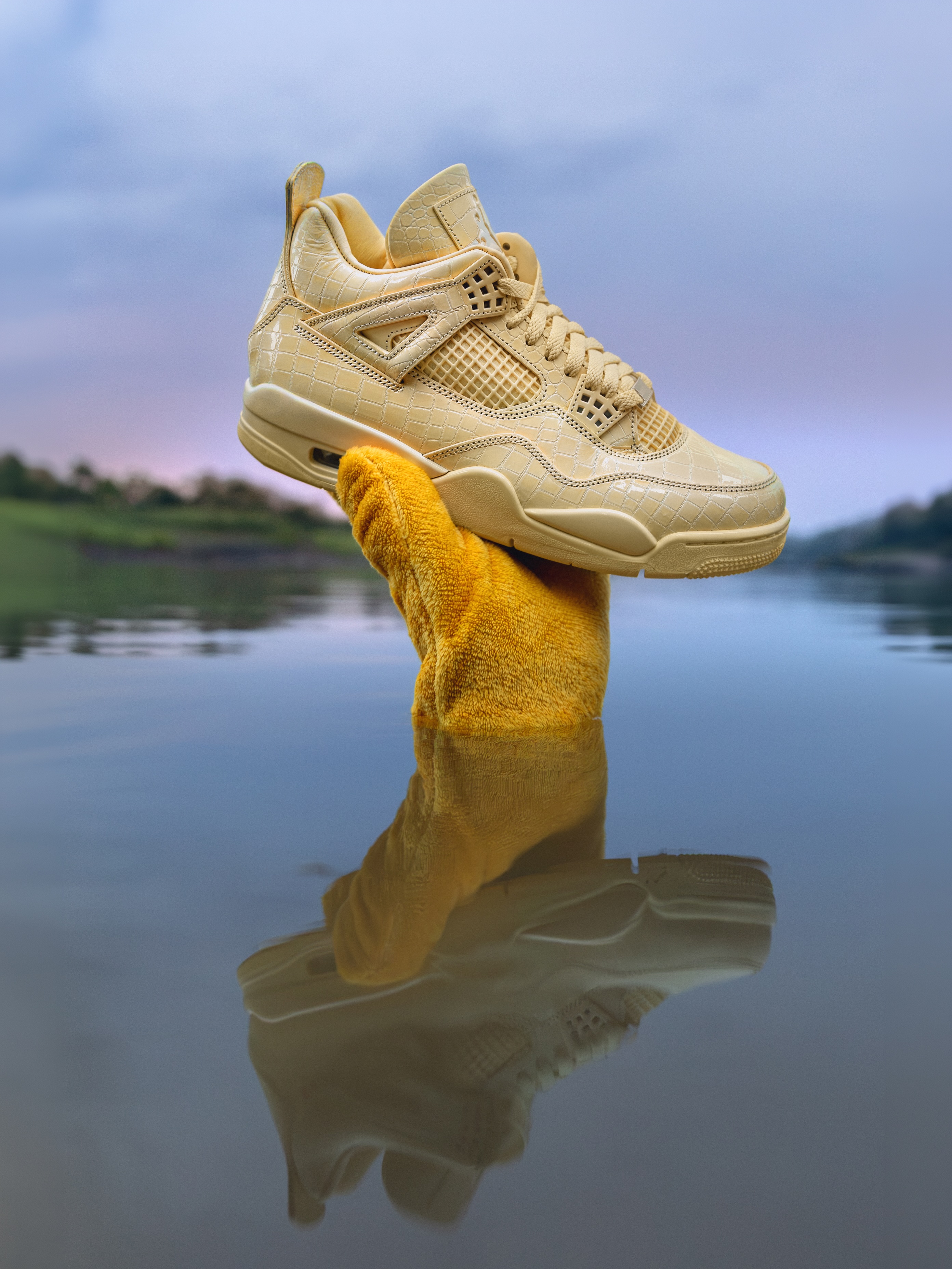 J Balvin's Air Jordan 4 Amazonas sneaker in yellow with a crocodile textured leather upper.