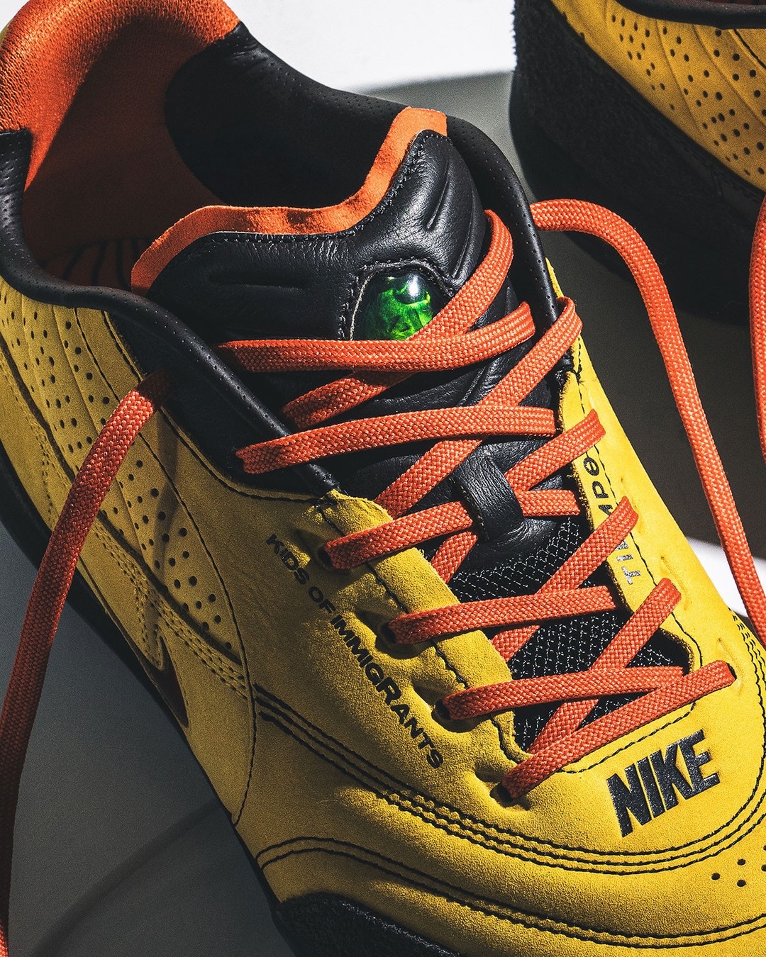Kids of Immigrants Splits Yellow Across Two Nike Tiempos (image 5)