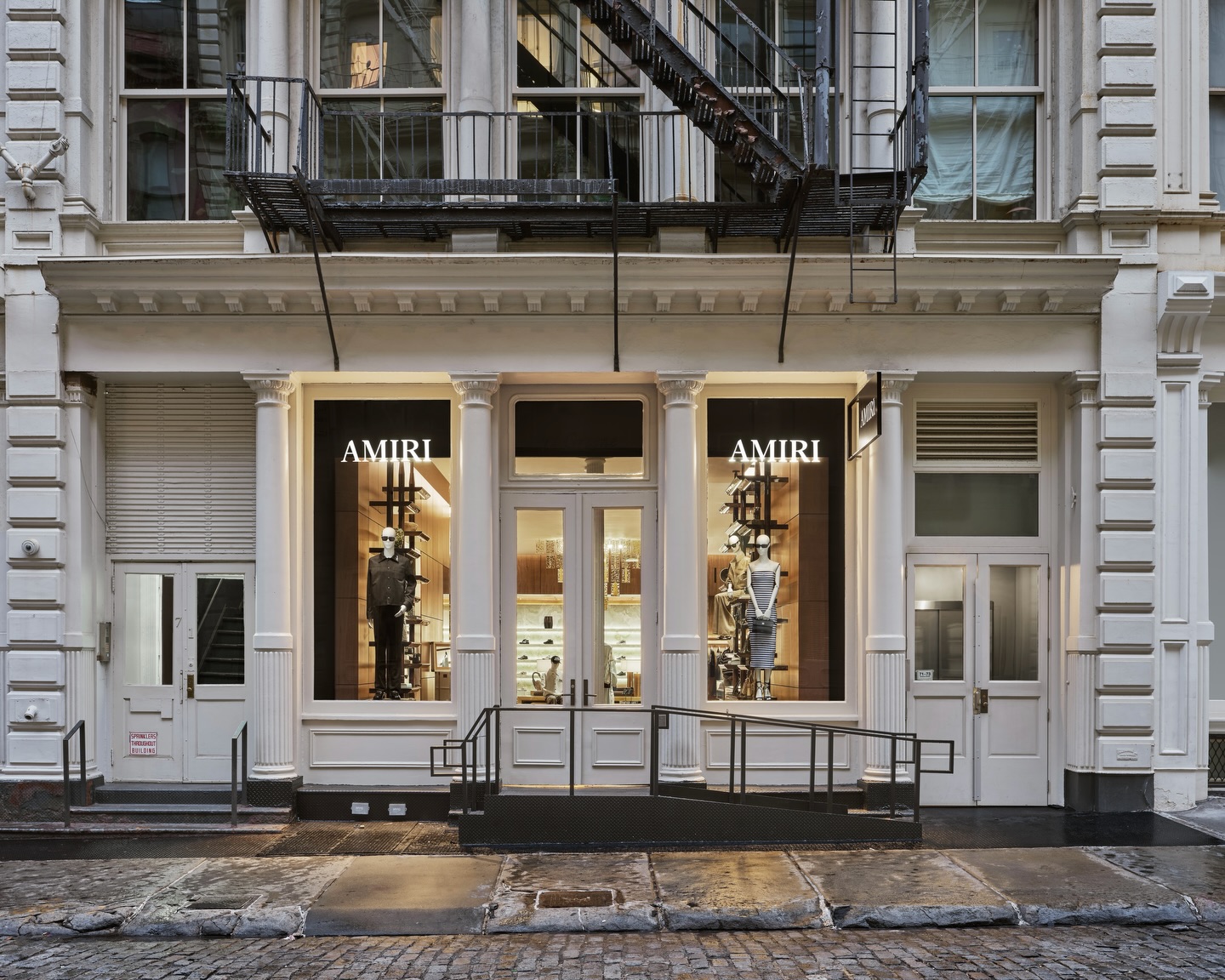The interior of AMIRI's new SoHo flagship store with onyx walls and custom glasswork.