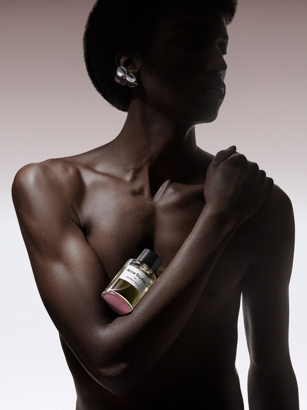 A campaign image for the Acne Studios par Frédéric Malle fragrance extension, photographed by Carlijn Jacobs.