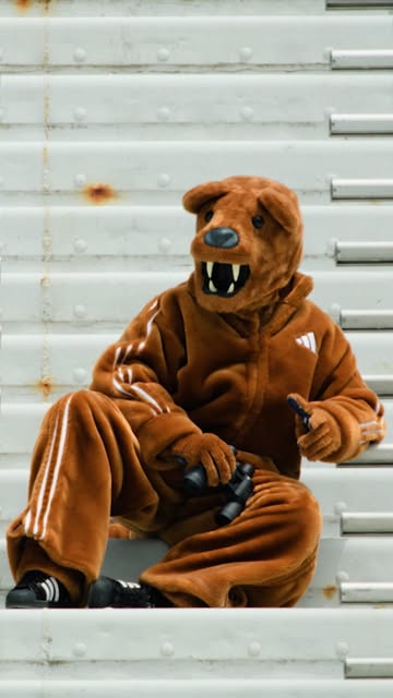 A Penn State Nittany Lions football uniform showing the Adidas three stripes logo on a navy blue jersey.