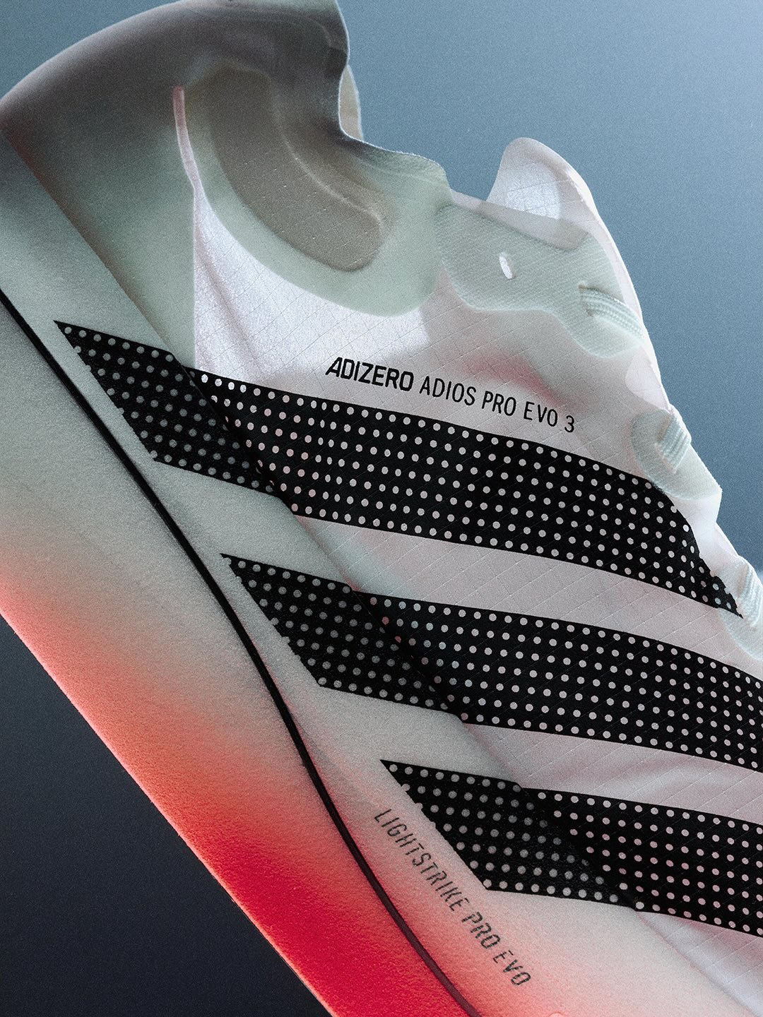 The underside of white Adidas running footwear in the Home of Innovation presentation.