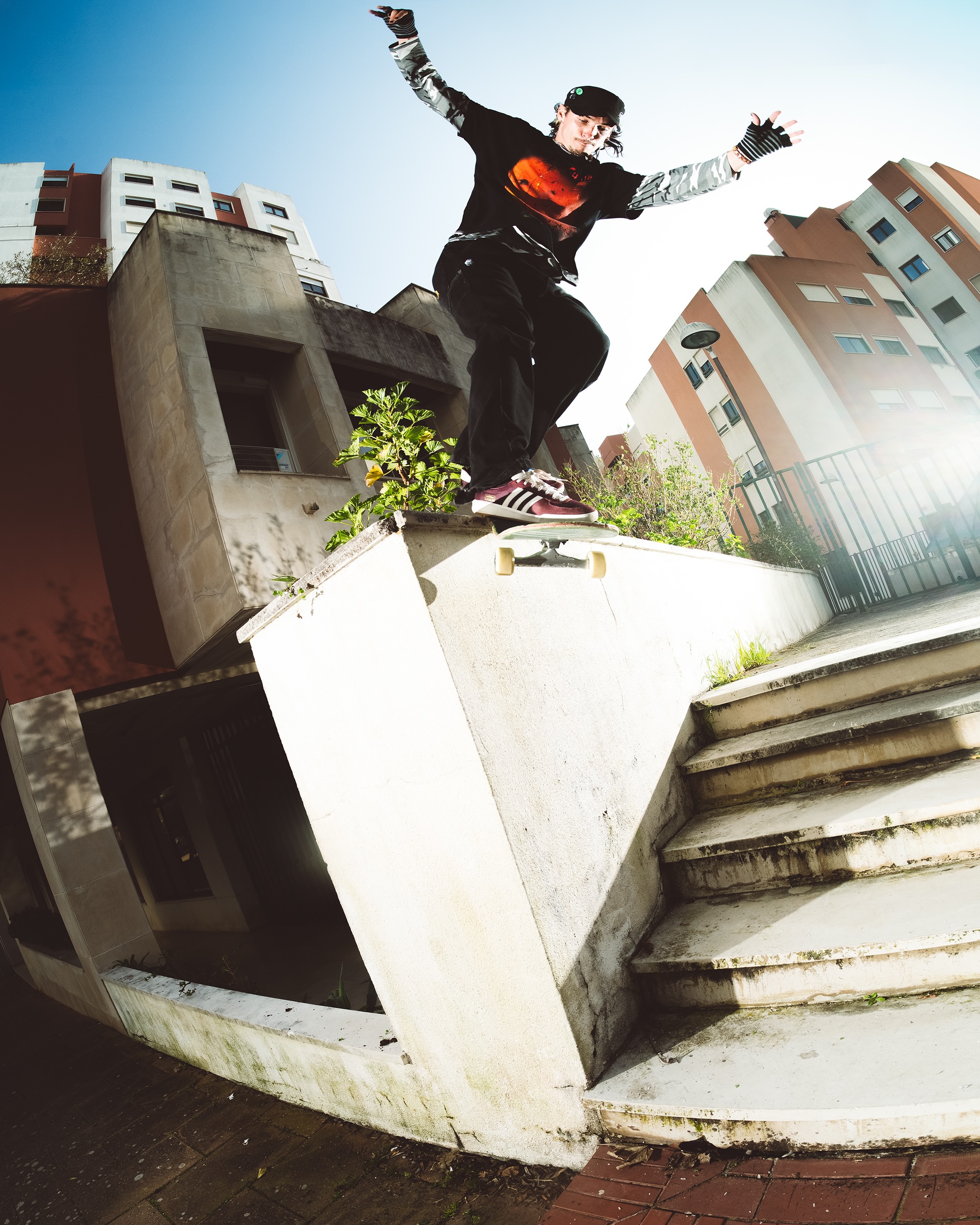 Tim Debauché performing a backside Smith grind in Lisbon for adidas Skateboarding's Glenburn.