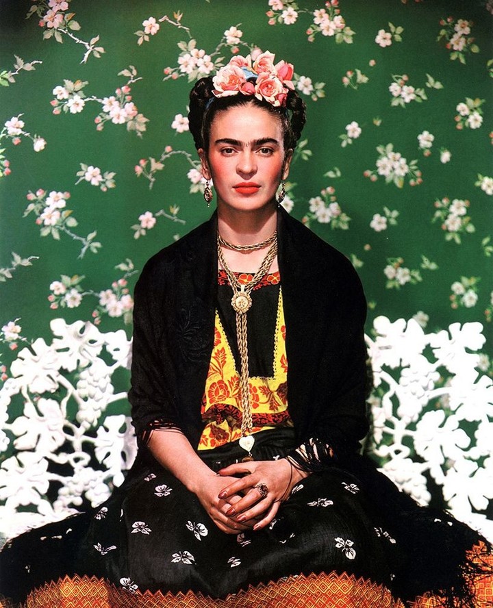 Frida Kahlo photographed by Nickolas Muray on a white bench in New York, 1939.