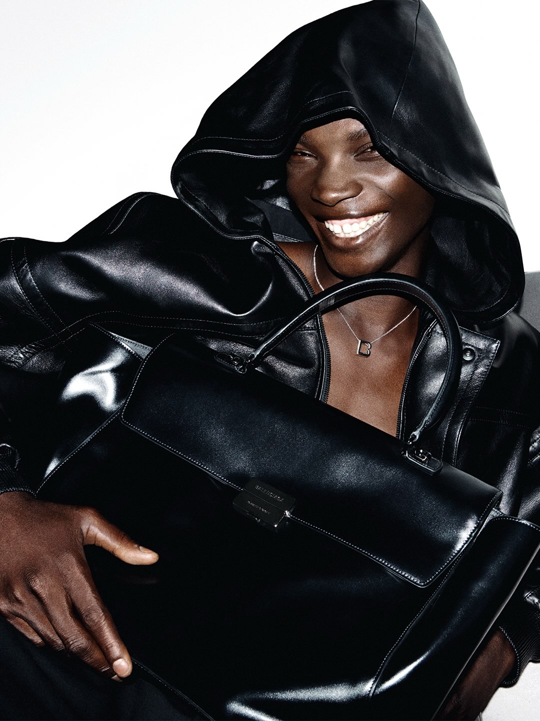 A model carrying the Balenciaga Hourglass Avenue Bag in the Winter 26 campaign
