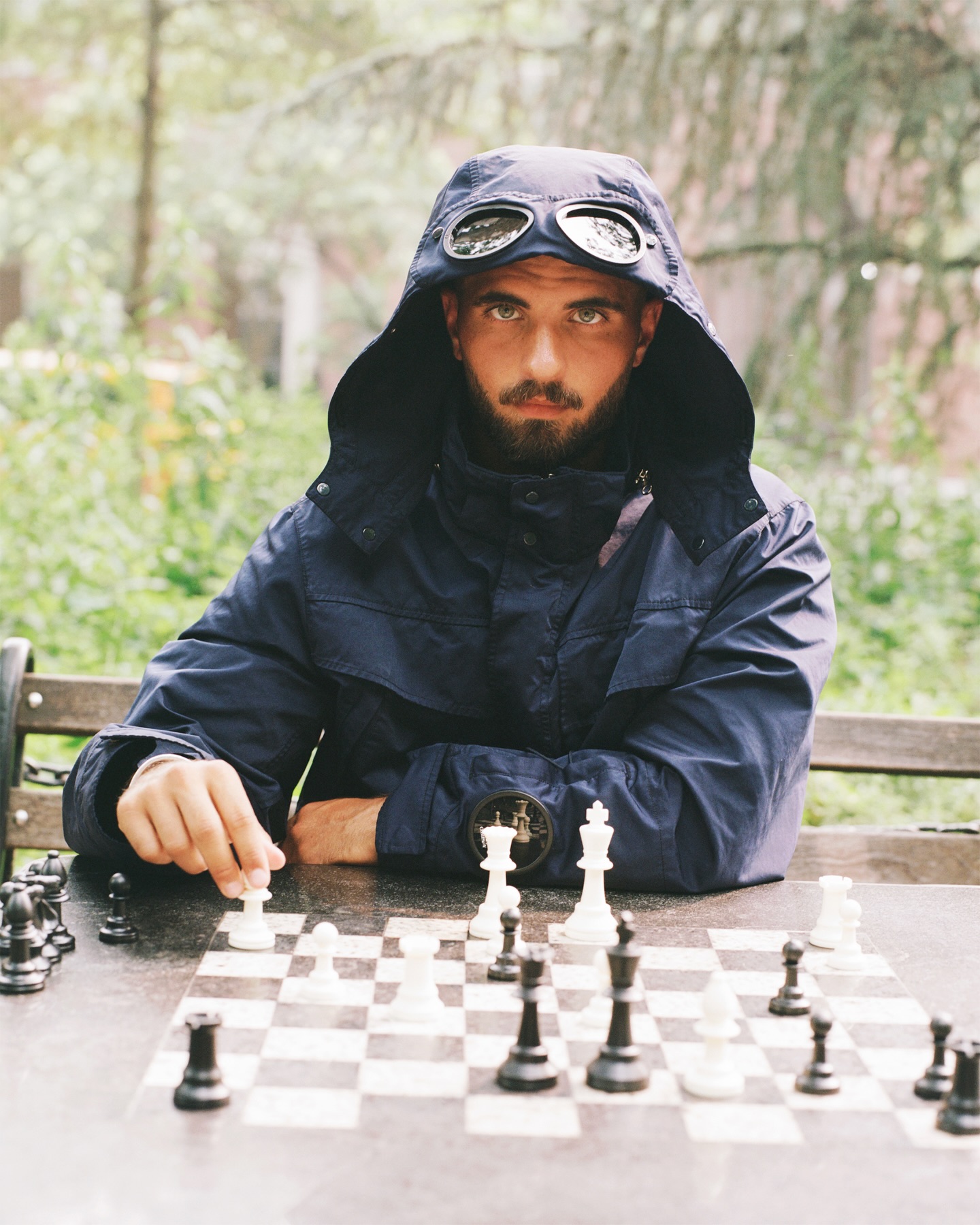 A C.P. Company campaign photograph from the Washington Square Park chess story, part of the FW026 collection.