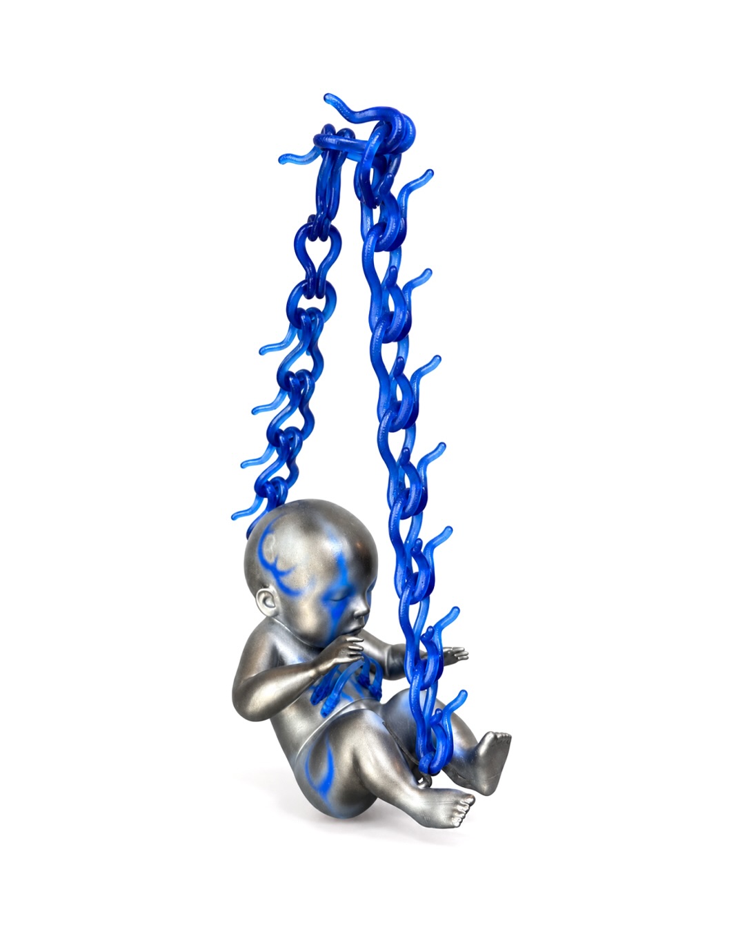 A sculptural handbag from Nik Sedlazek's Artificial Offspring series, shaped to resemble an infant with visible rib and spine detailing.