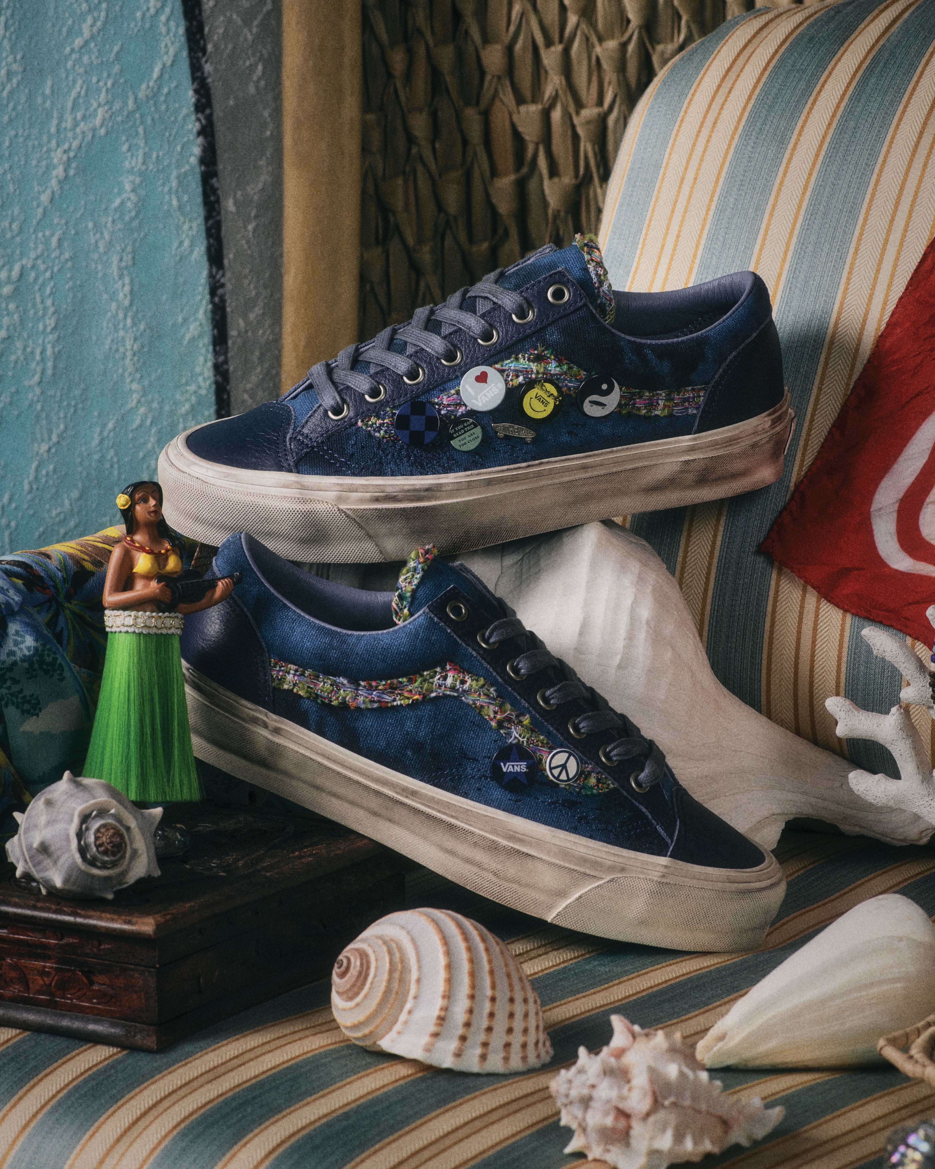 The Vans Old Skool 36 LX Souvenir sneaker in navy blue with a multicolor bouclé Sidestripe and enamel pins.