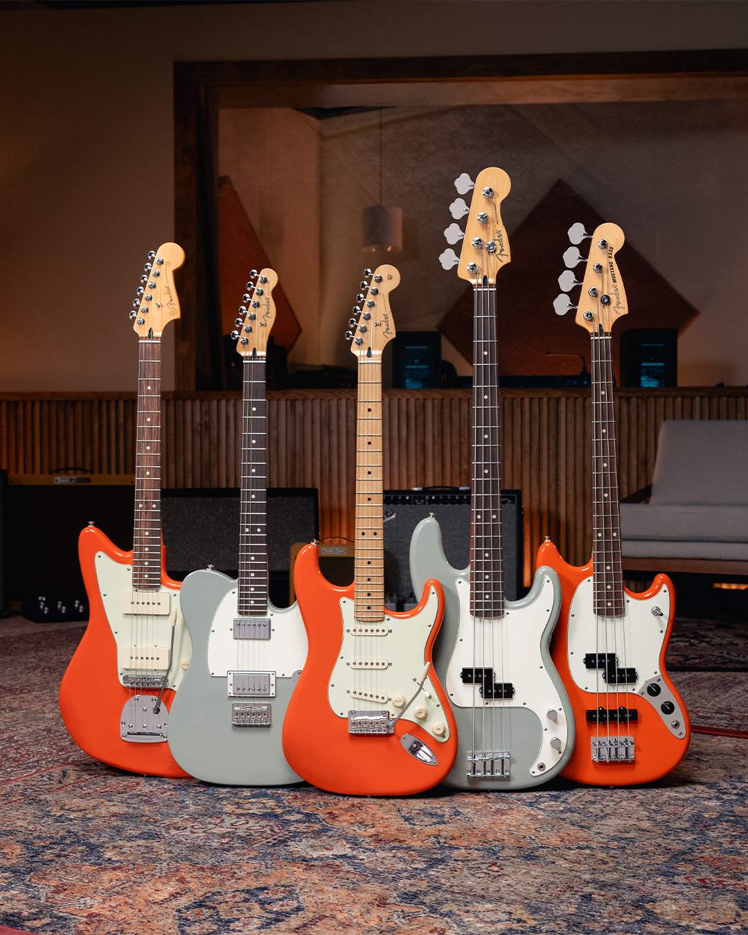 Fender Player II electric guitars shown in the new Rallye Orange and Cactus Gray finishes.