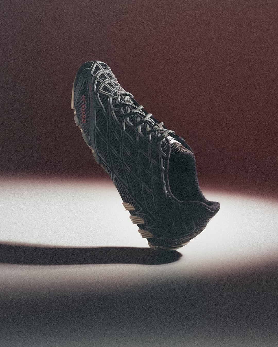 Product shots of the adidas Originals x Bad Bunny F50 Ghost Sprint Charcoal football boot.