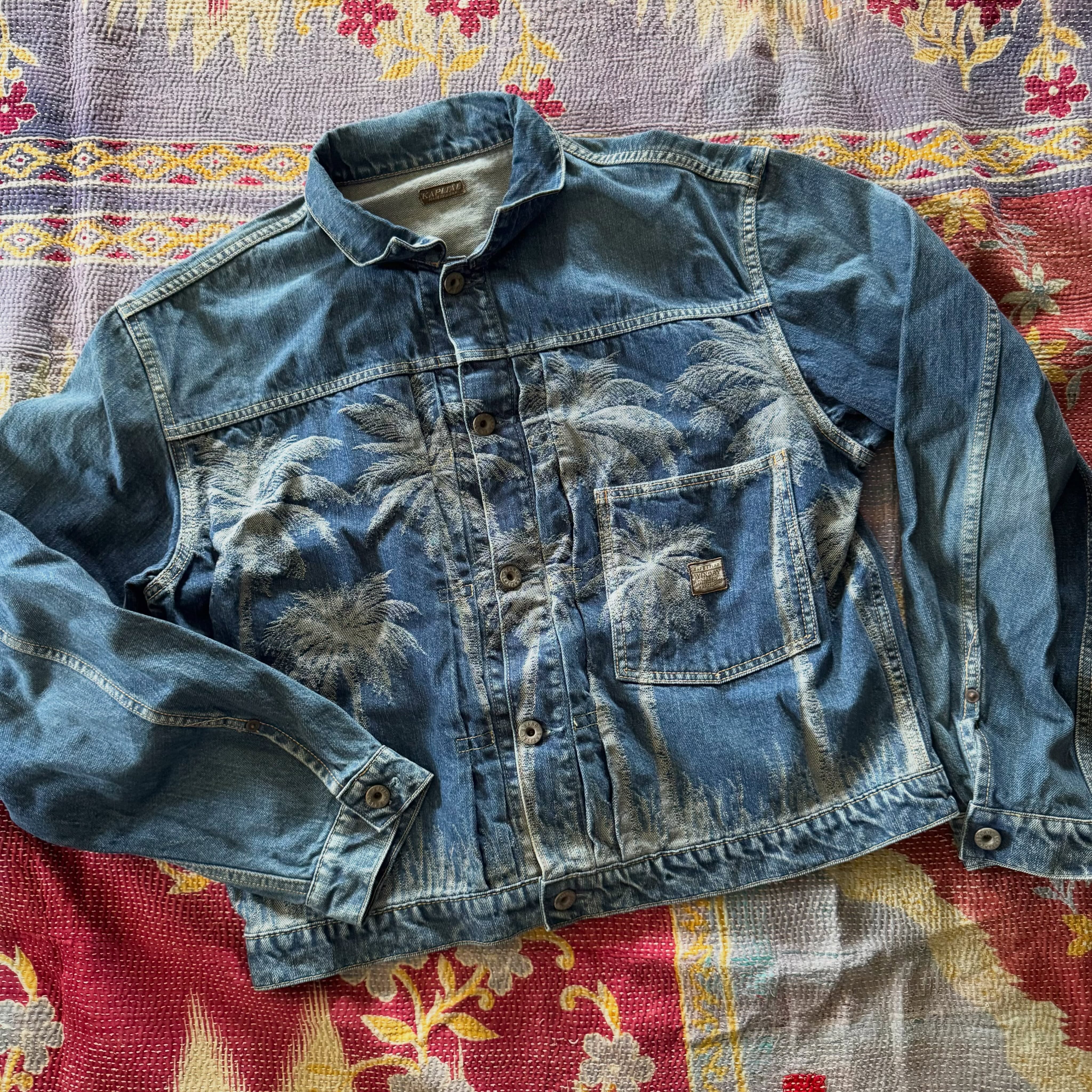 Product photo of Kapital's aloha themed 1st Type denim jacket with palm tree jacquard weave