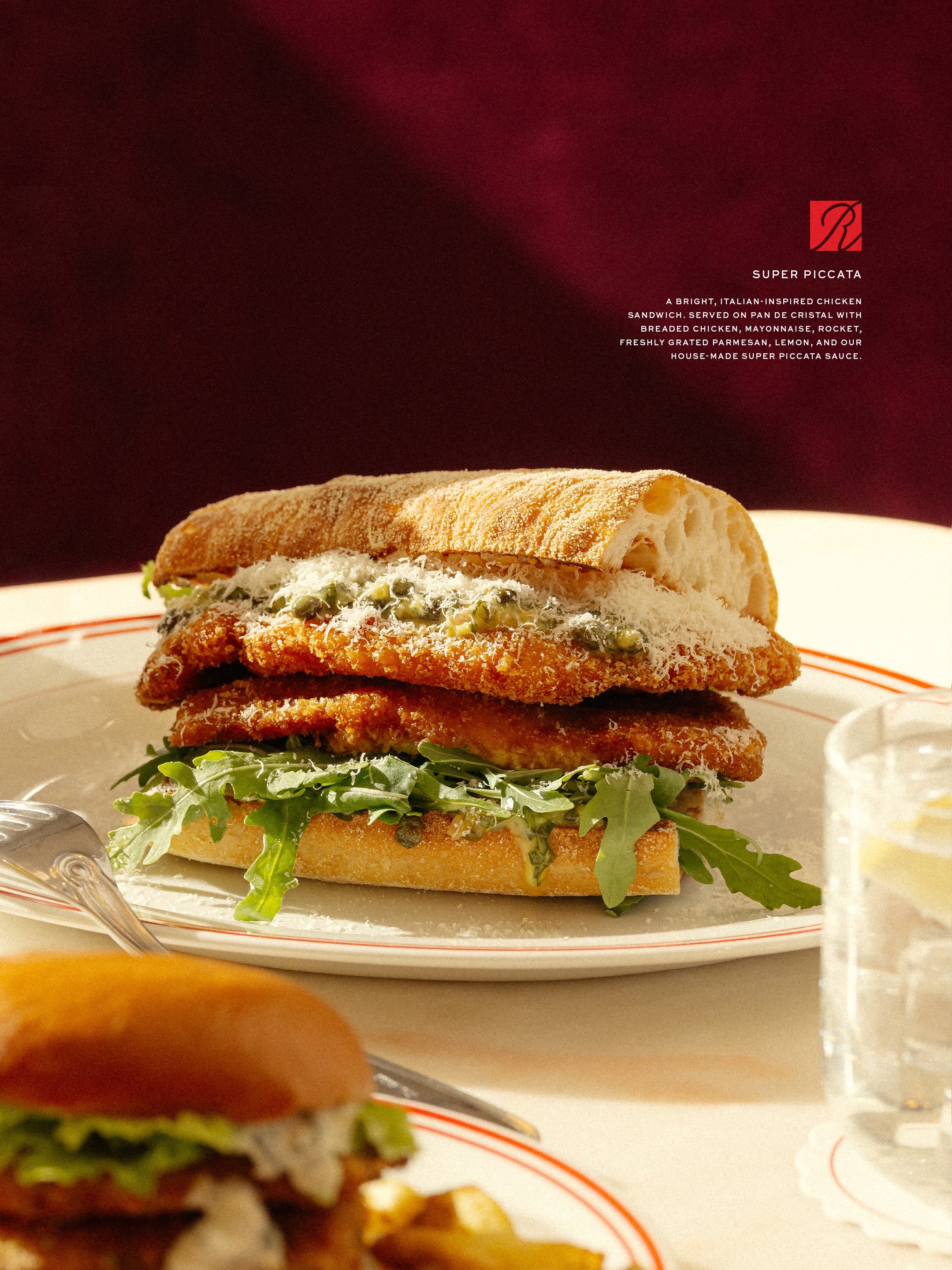 Promotional image for Kith's Ronnie's restaurant in London announcing the new lunch menu launching July 9.