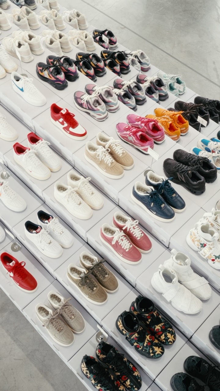 Rows of shoes on white stands fill Kith’s Footwear Archive exhibition.