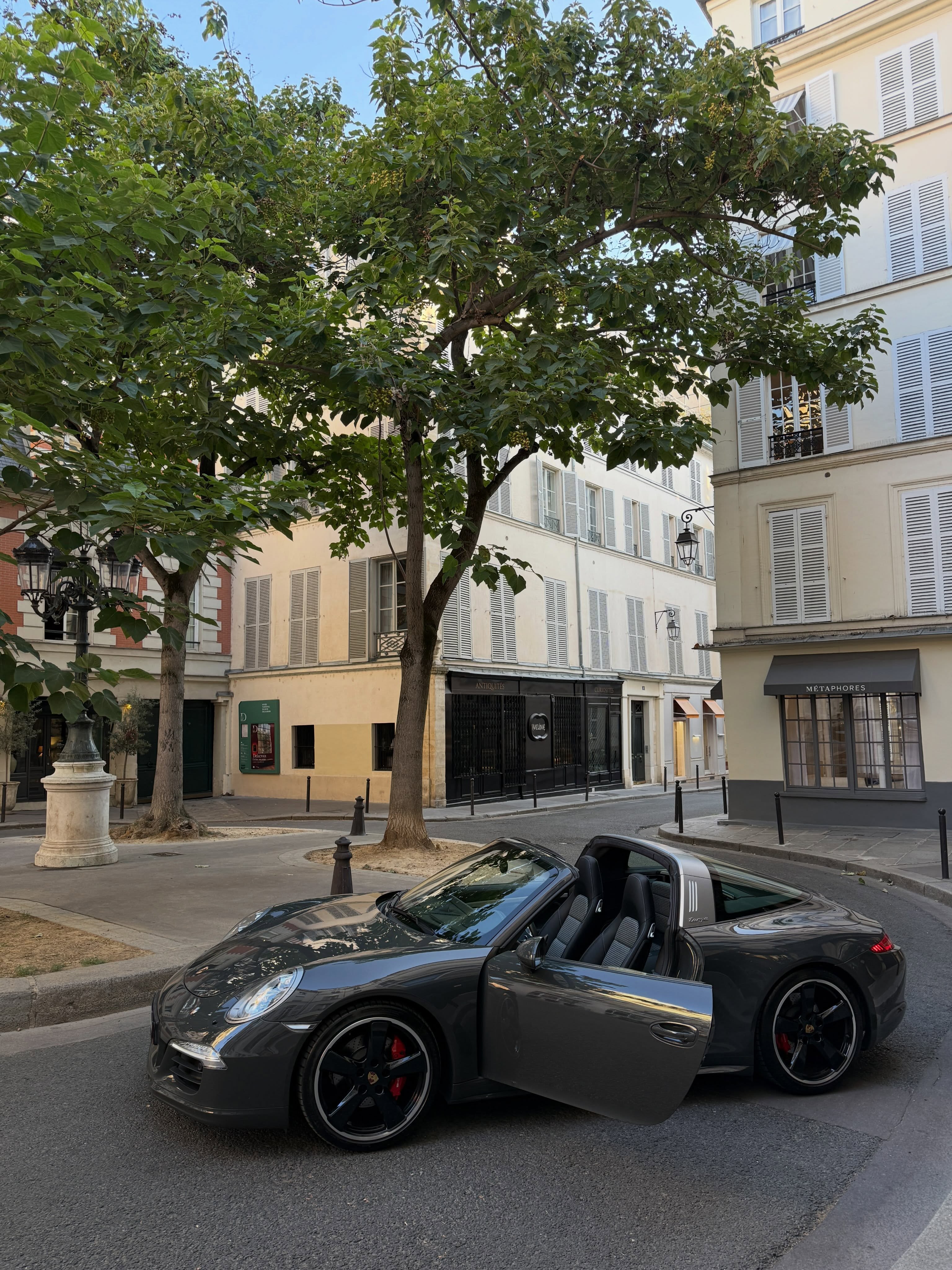 A slate grey Porsche 991 Targa 4S with matching lower bodywork and Fuchs style 20 inch wheels, photographed in profile.