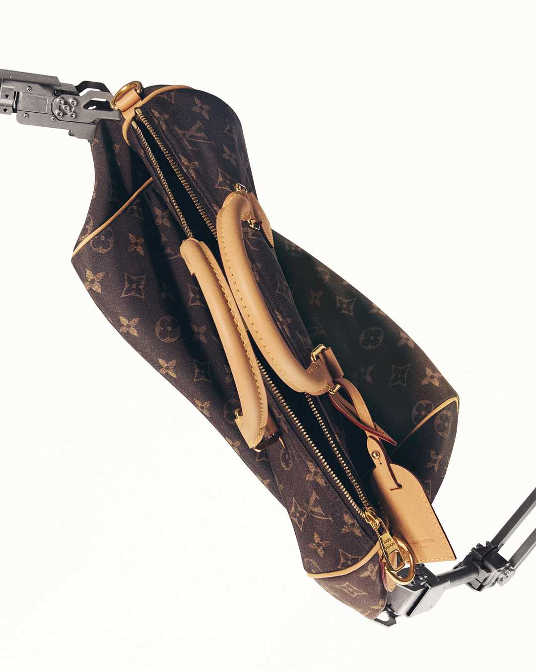 A close detail shot of Louis Vuitton Silk Tech fabric showing its silk and reclaimed nylon sheen on a folded garment panel.