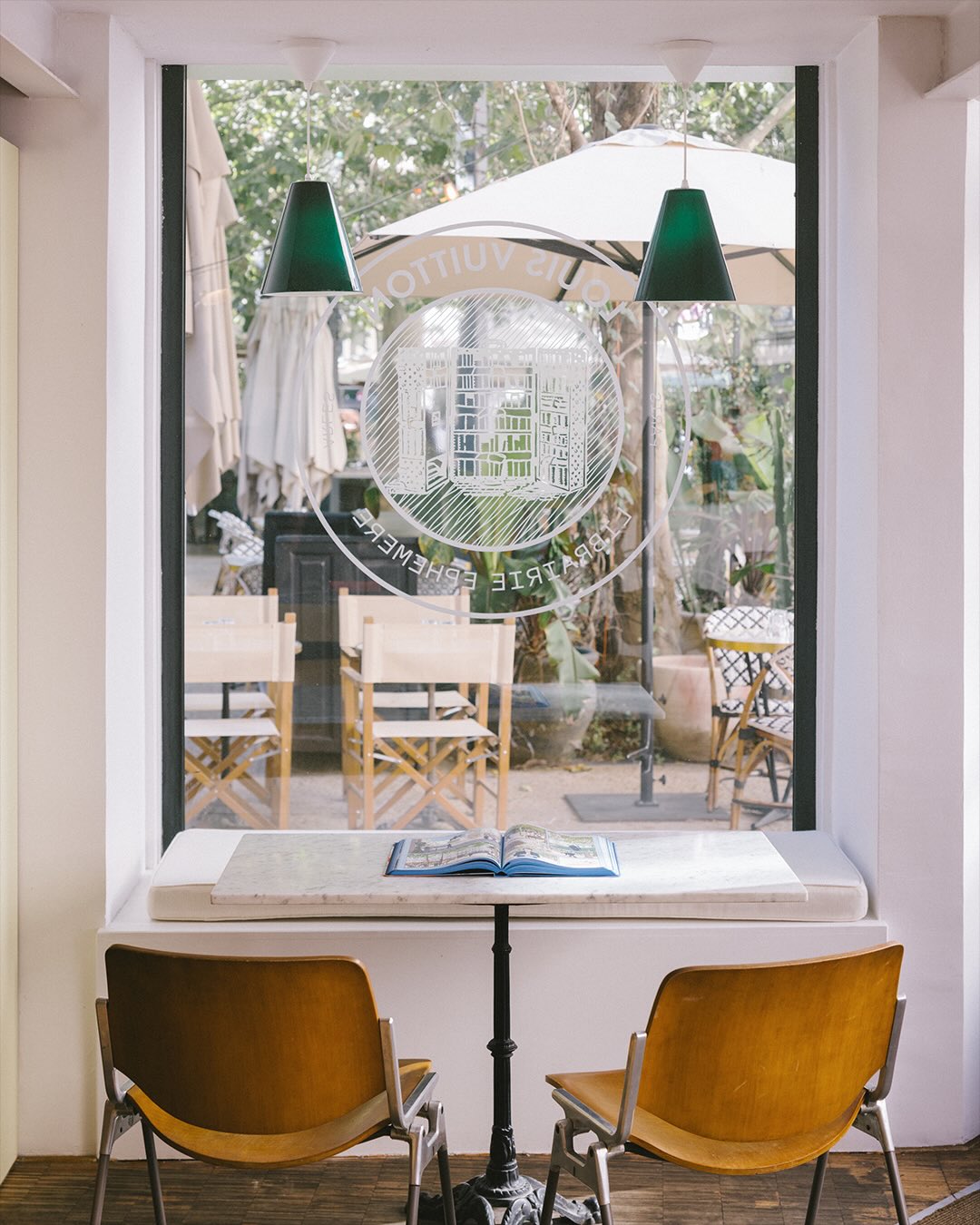 A carousel image from Louis Vuitton's Instagram post on the Le Buste et l'Oreille pop up bookstore in Arles.