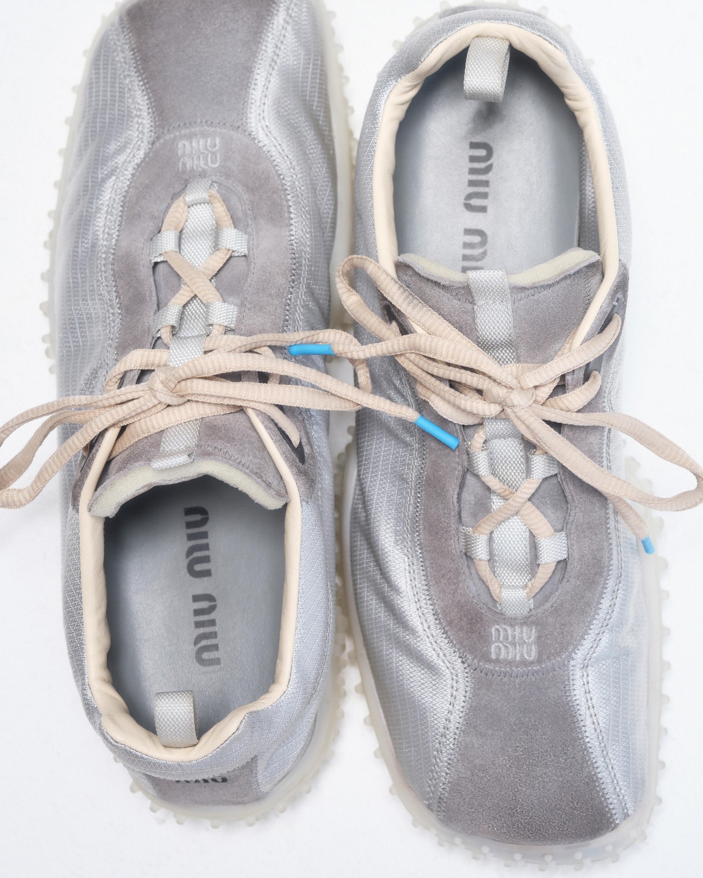 The Miu Miu Bubble sneaker, an archive sportswear silhouette reissued in suede and technical fabric with a layered rubber sole.