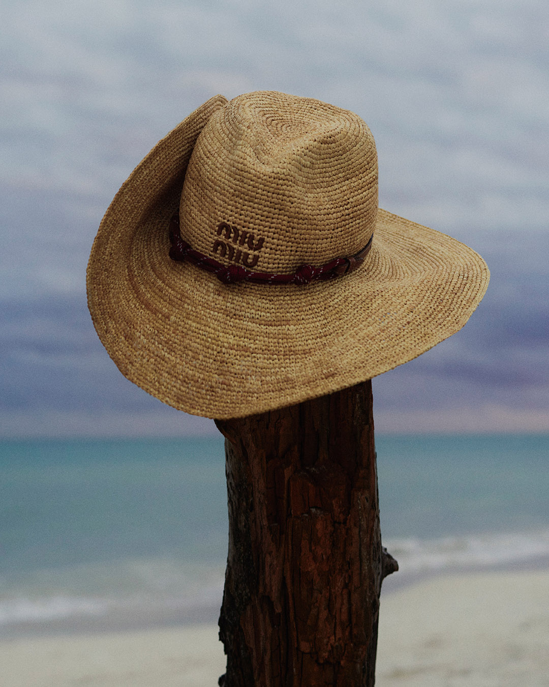A model wearing Miu Miu's L'Ete 2026 cotton drill cowboy hat and accessories
