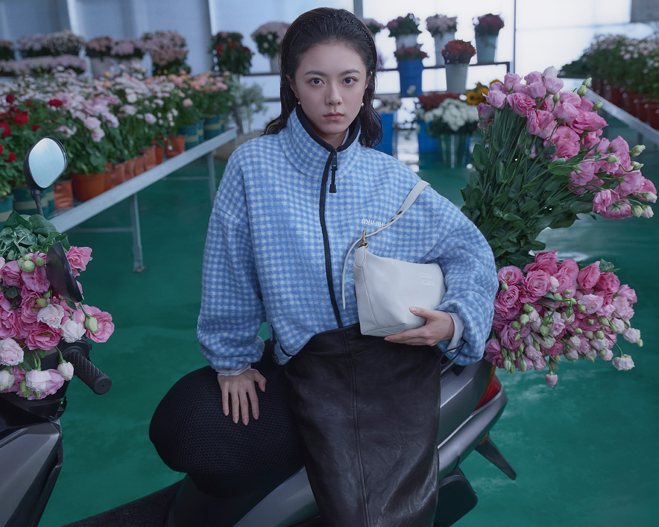 Zhao Jinmai in Miu Miu's Qixi Festival 2026 campaign surrounded by colored flowers.