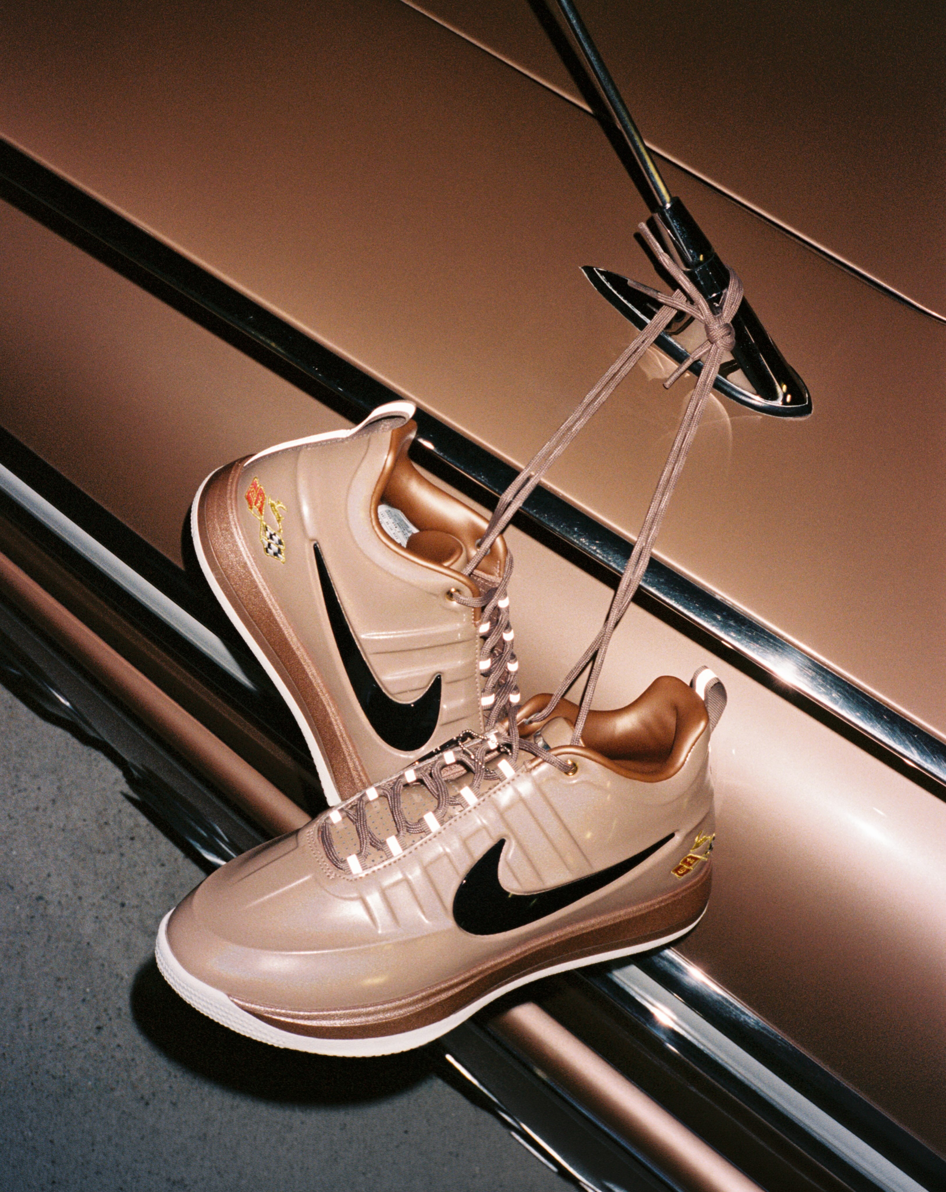 The Nike Book 2 Pretty Penny basketball shoe in its metallic red bronze, sail and black colorway.