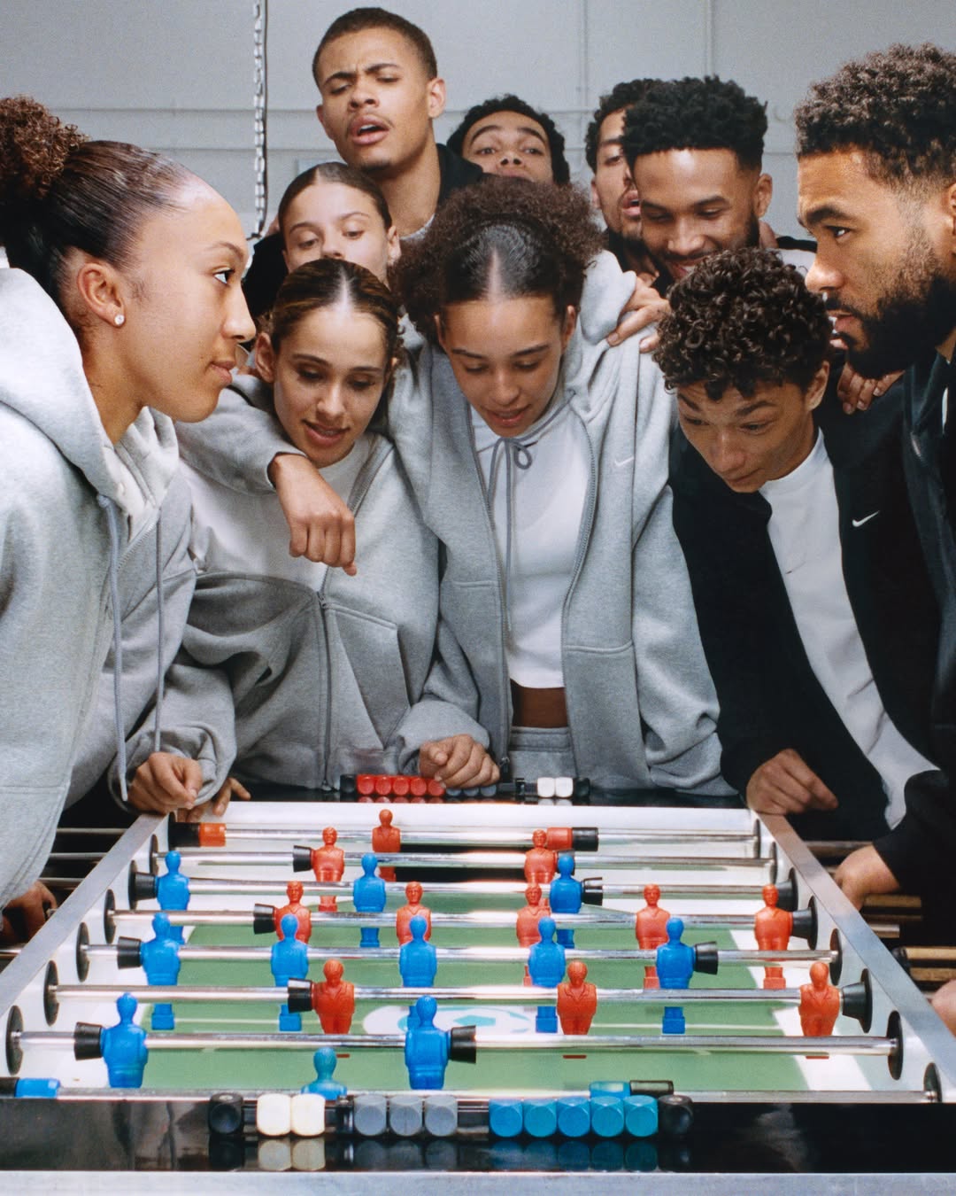 Nike Studio Fleece crew and Solo Fleece pant shown together in a product image for the Nike Sportswear fleece collection.