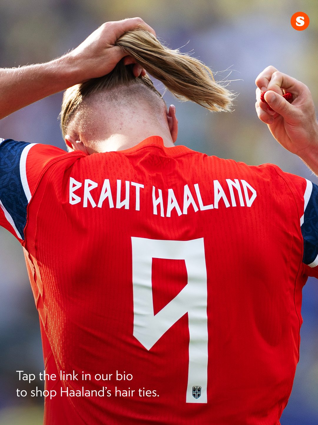 Erling Haaland shown with his signature man bun held by a Kknekki hair tie.