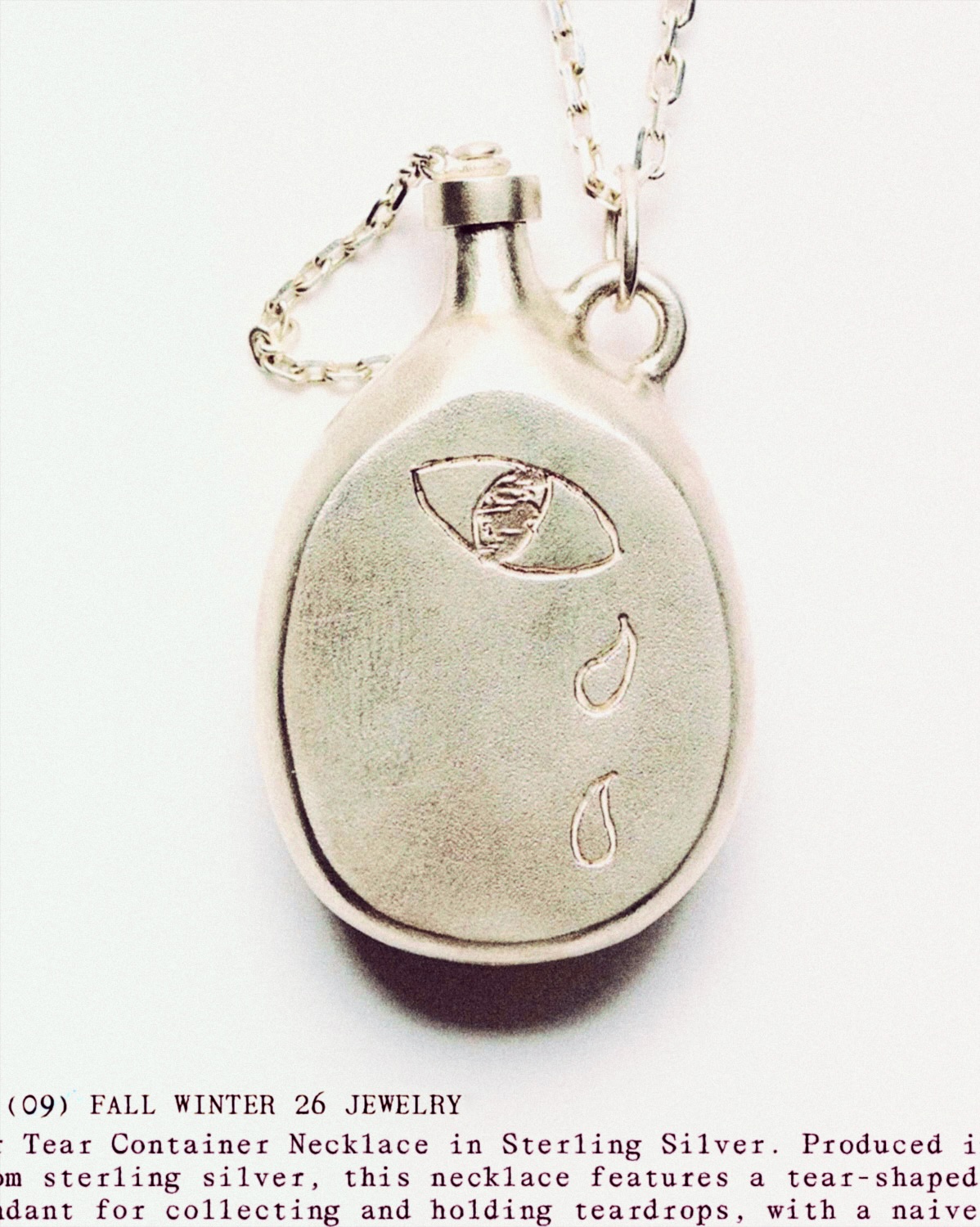 A silver tear container necklace from Our Legacy's Fall Winter 2026 jewelry collection.