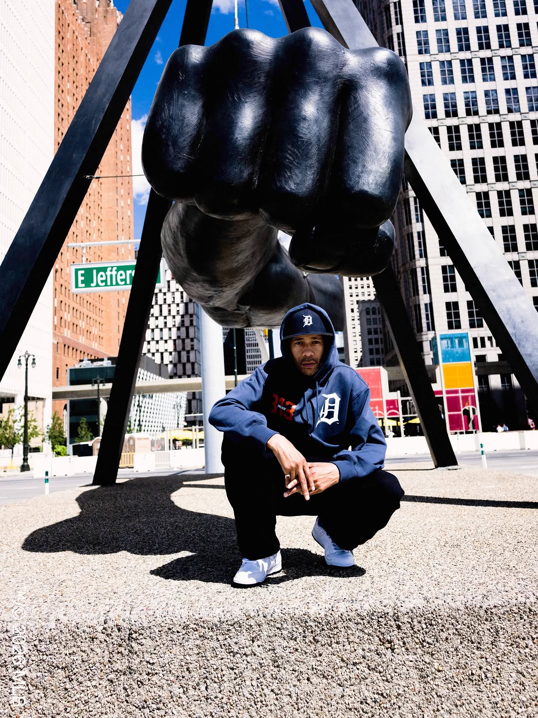 Palace Detroit Tigers campaign photo showing navy, orange, and white apparel with 313 area code branding