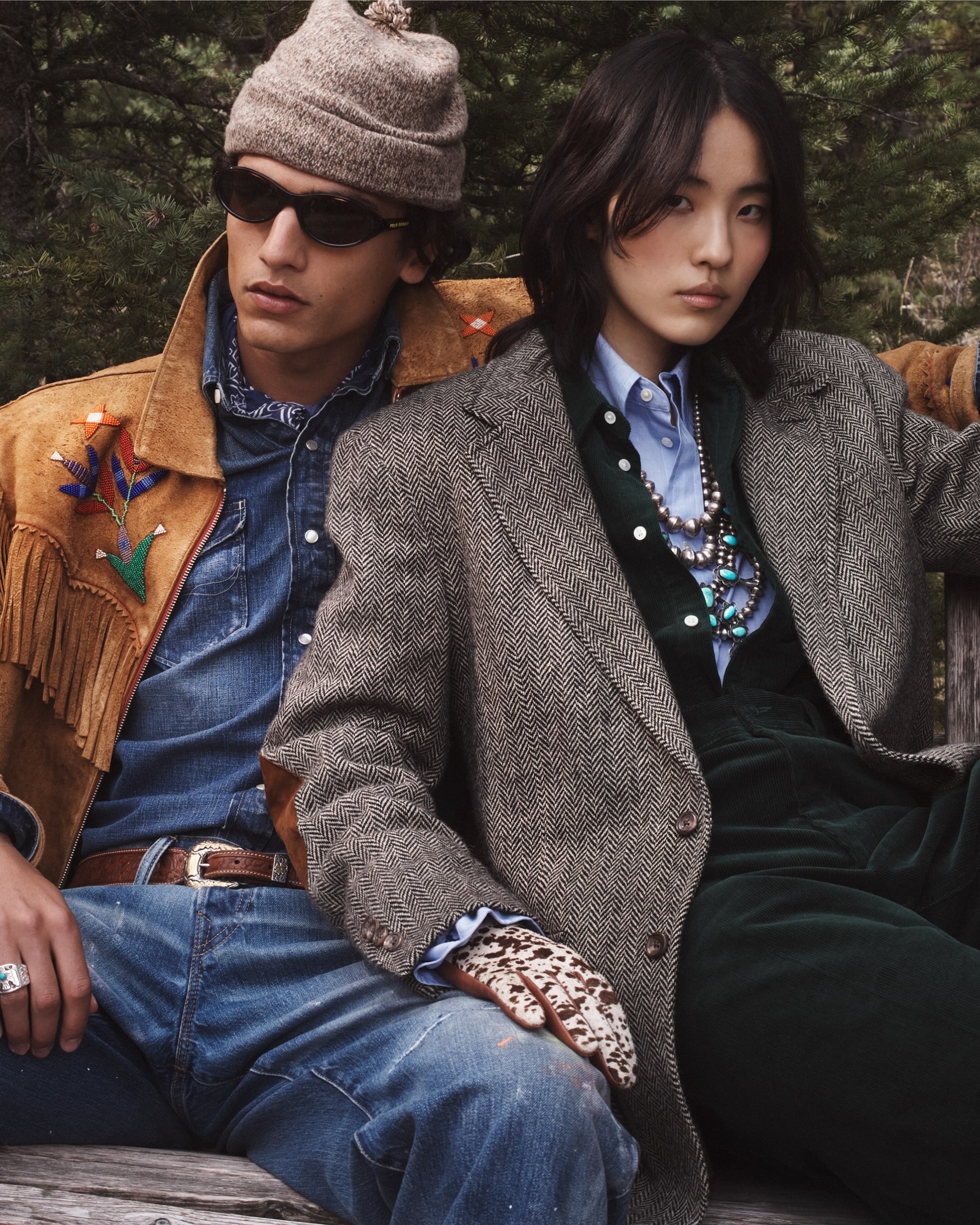 Grey tailoring and denim appear beside a tan fringed layer in Ralph Lauren’s woodland imagery.