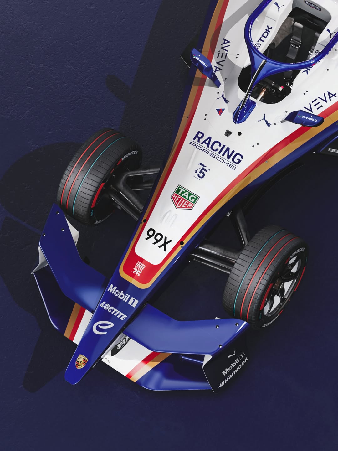 The Porsche 99X Electric Formula E car painted in the blue, white and red livery of the 1982 Le Mans winning 956.