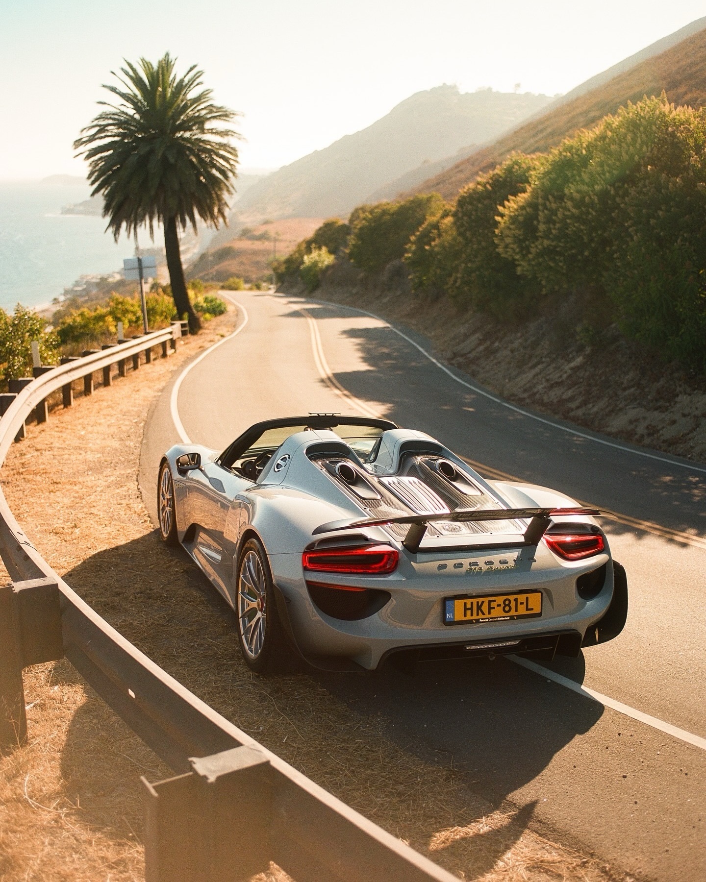 A grid of Porsche cars including a 911 GT3 RS and Taycan photographed by community owners for World Photography Day.