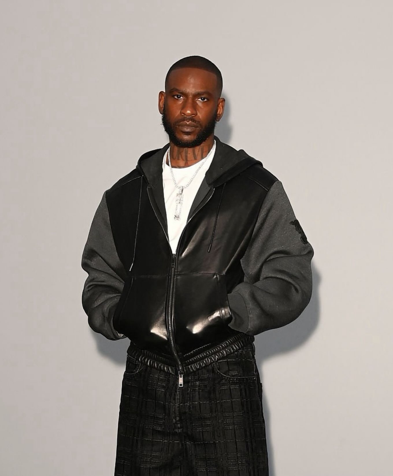 Skepta photographed at Hotel Cafe Royal in London wearing Burberry and Stone Island.