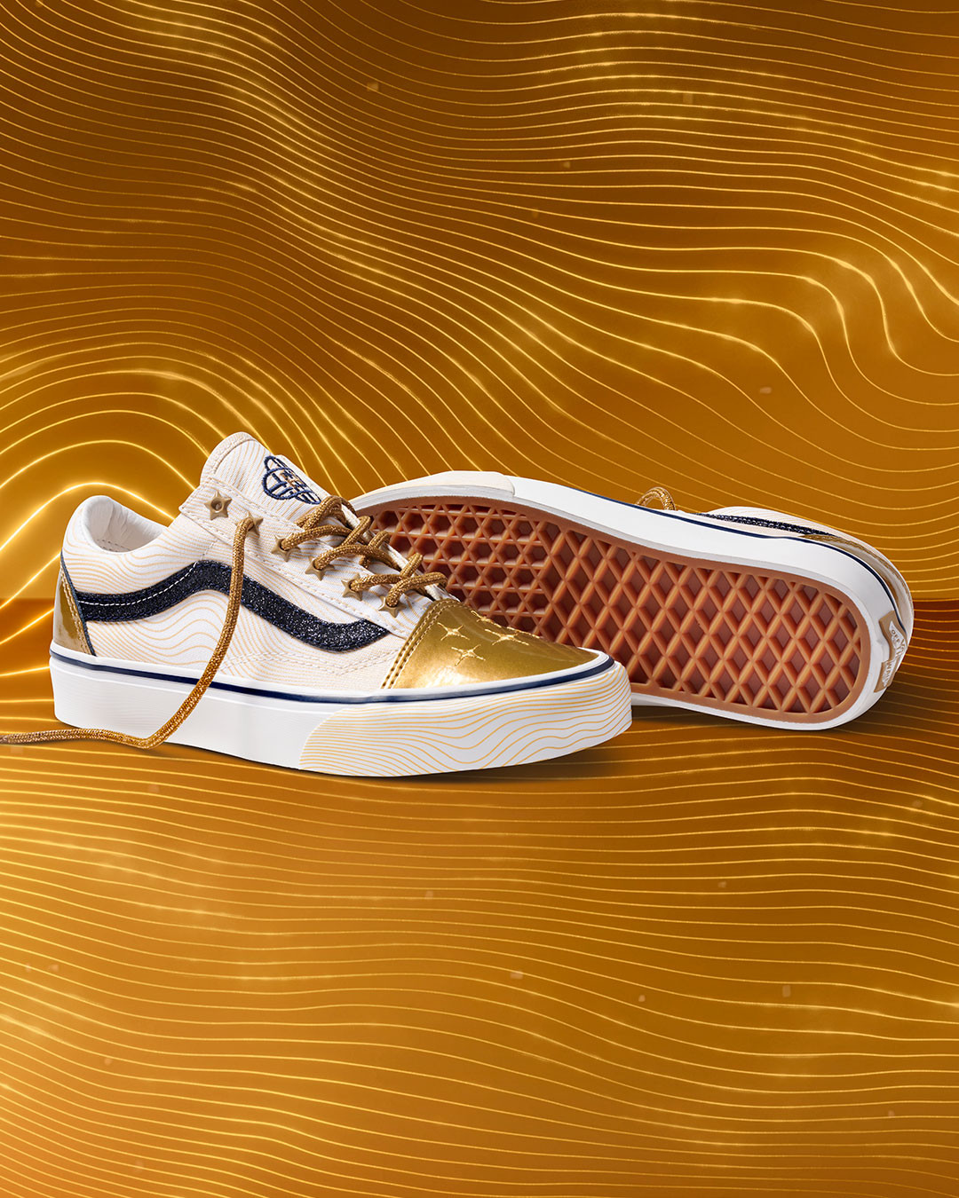 Vans Old Skool sneaker from the KPop Demon Hunters Golden Collection with a gold star studded upper and HUNTR/X branding on the tongue.