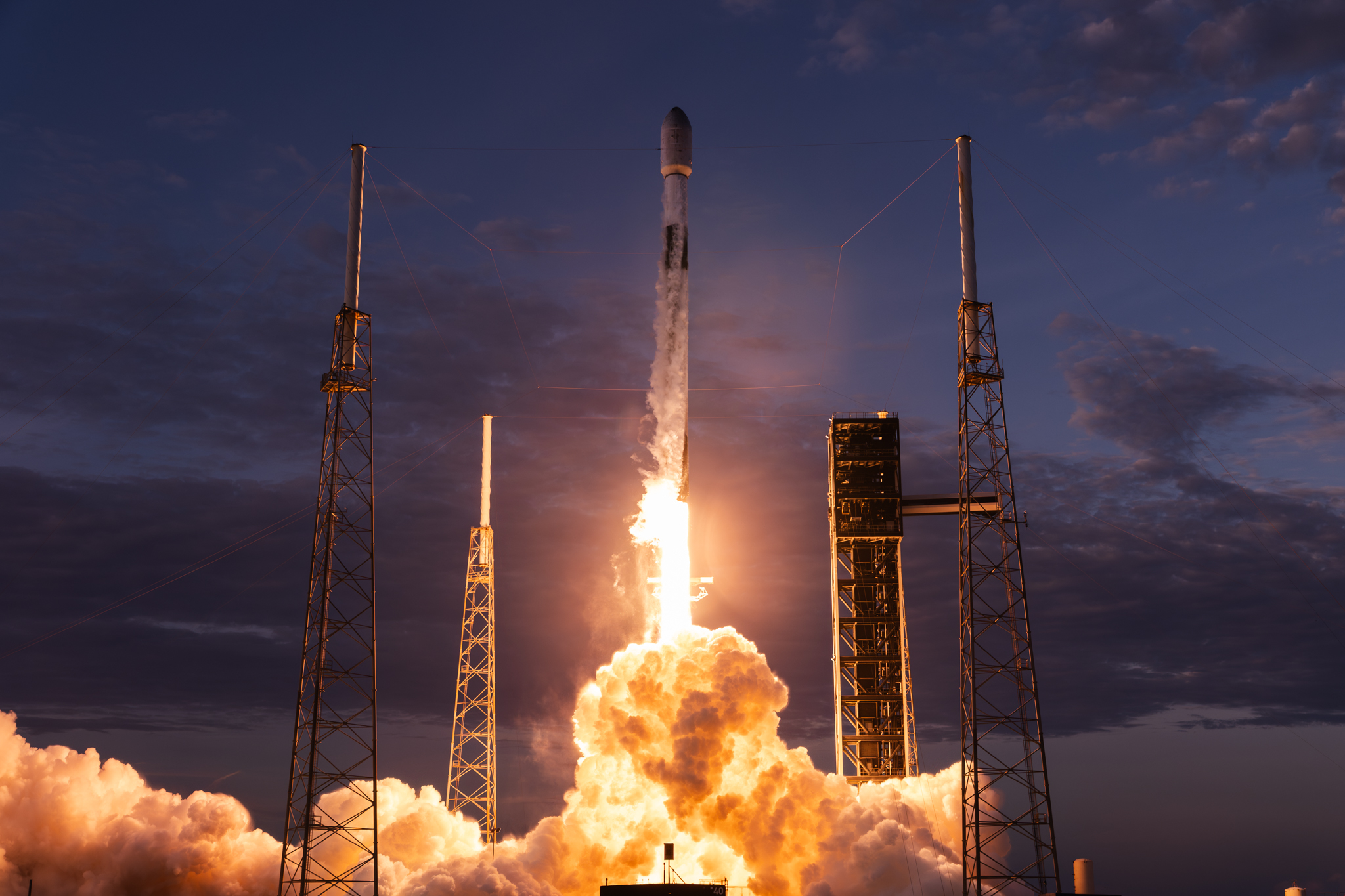 A SpaceX Falcon 9 rocket launching from Cape Canaveral carrying 29 Starlink satellites and Besxar's first Fabship payload.