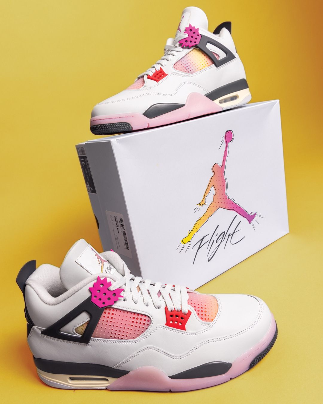 The Air Jordan 4 Comic sneaker showing its POW shaped eyelets and pink toned mesh detailing