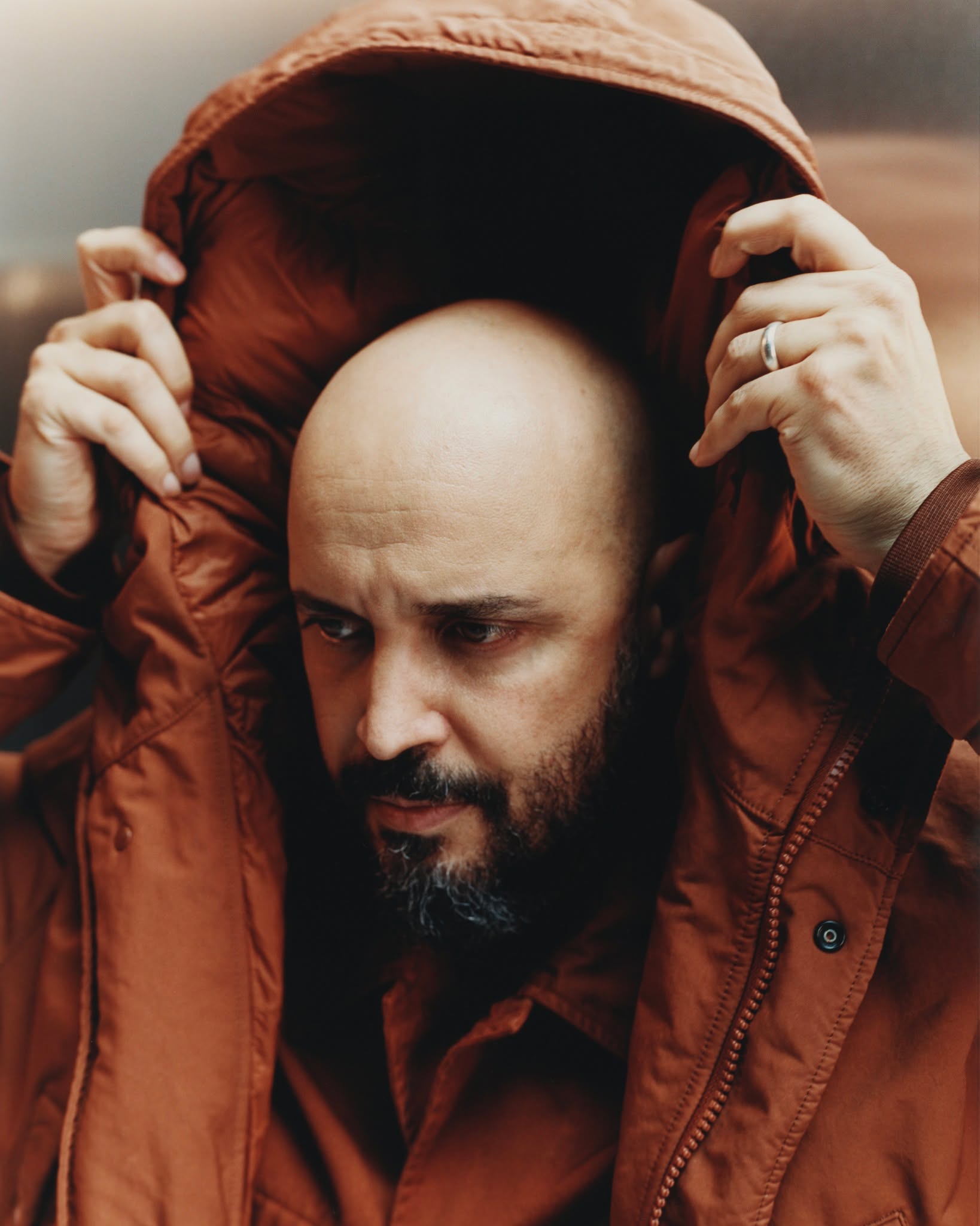 Samir Bantal wearing Stone Island's 4100062 David-TC Ghost parka in a behind the scenes Autumn Winter 026 campaign photo