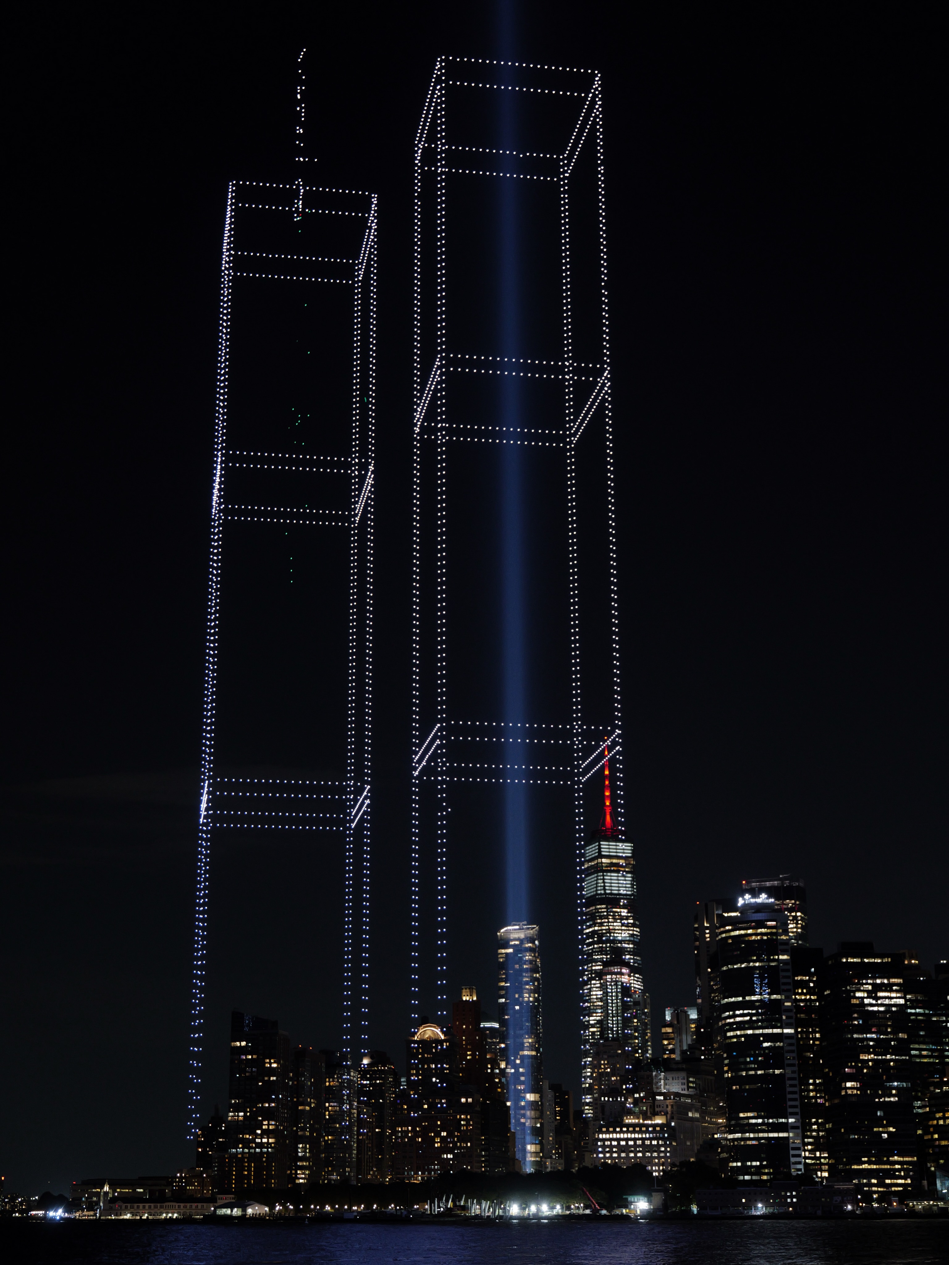 Drone light formation recreating the Twin Towers over New York Harbor for the 25th anniversary of September 11