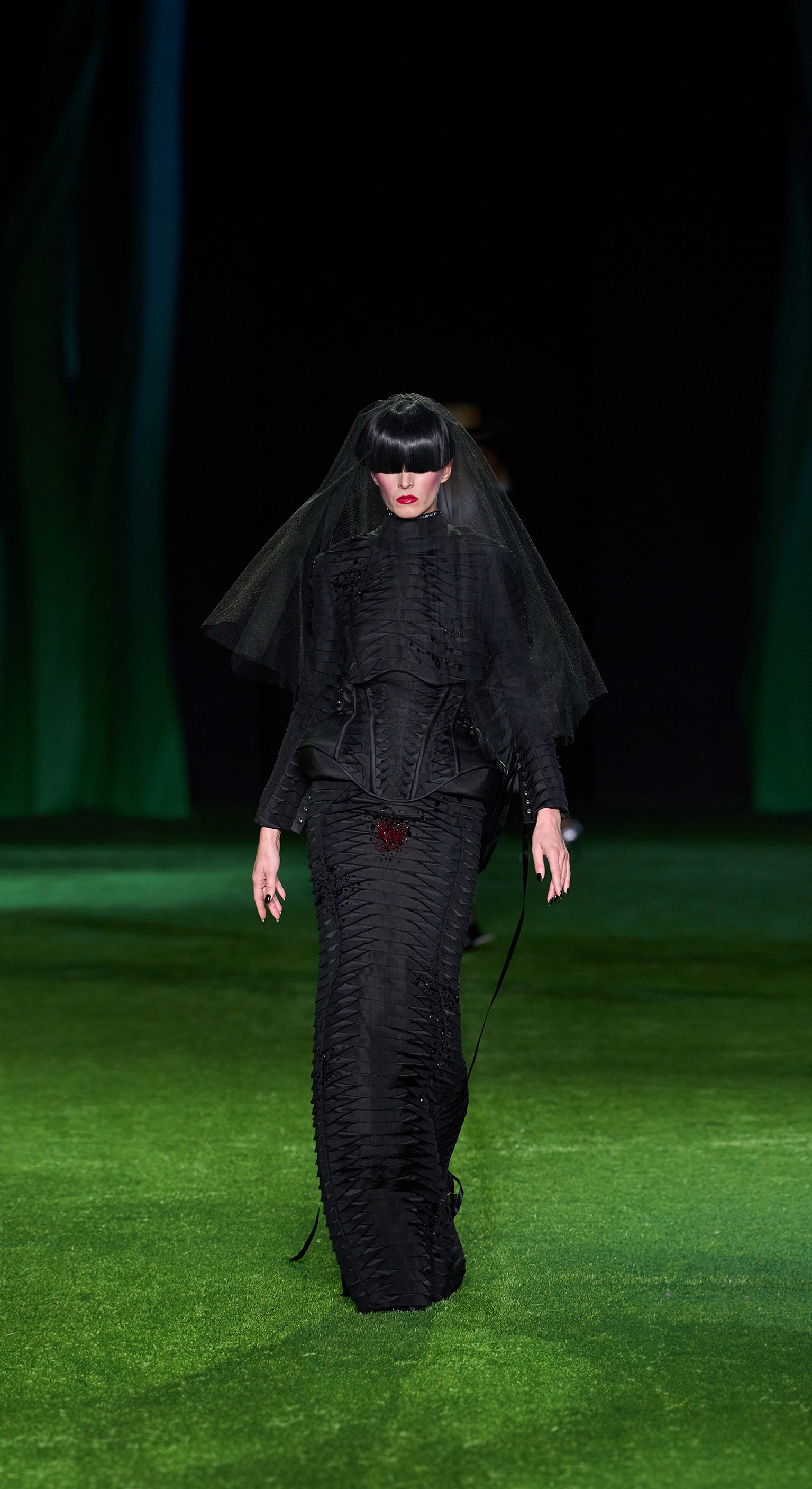 A look from Thom Browne's Spring 2027 womenswear collection, styled as part of the show's caterpillar to butterfly theme.