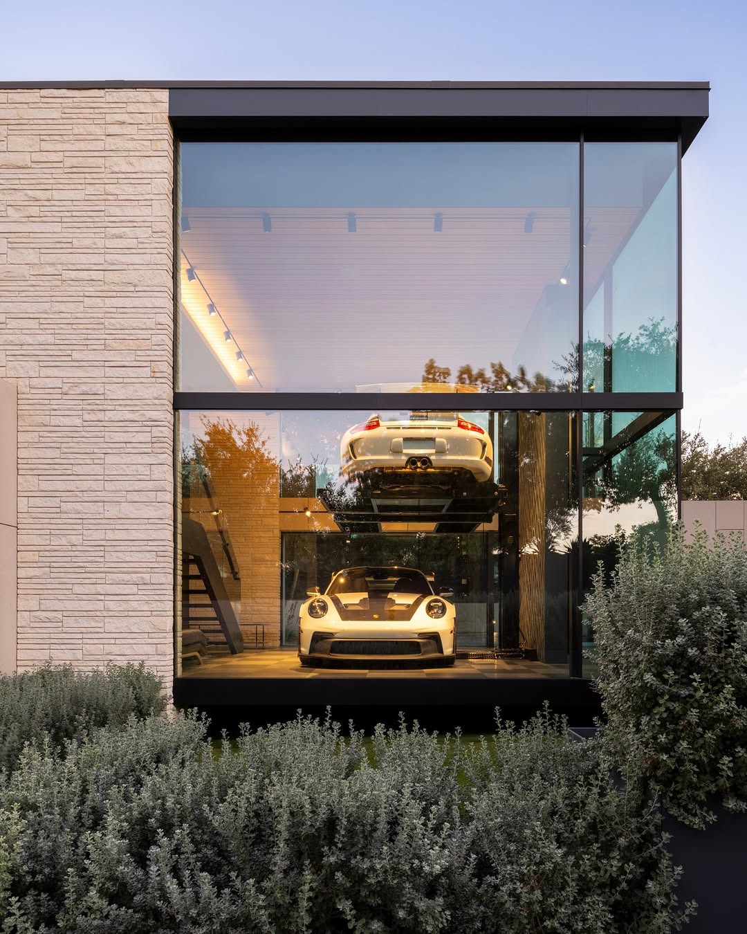 OCTANT HOUSE BY MF ARCHITECTURE MAKES THE GARAGE THE CENTRAL SPACE