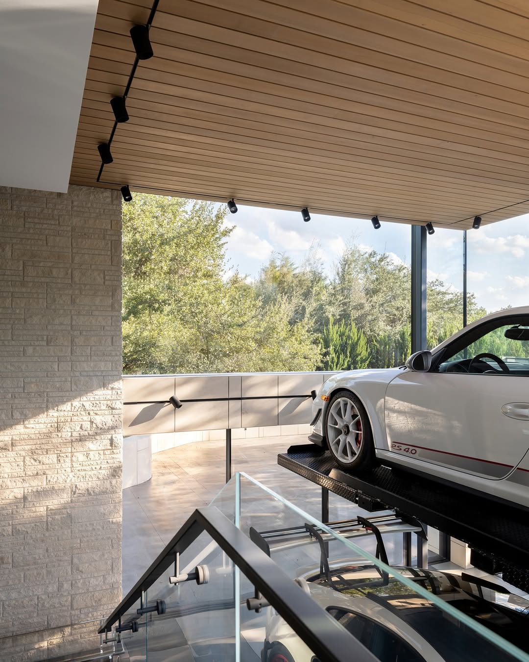 OCTANT HOUSE BY MF ARCHITECTURE MAKES THE GARAGE THE CENTRAL SPACE (image 2)