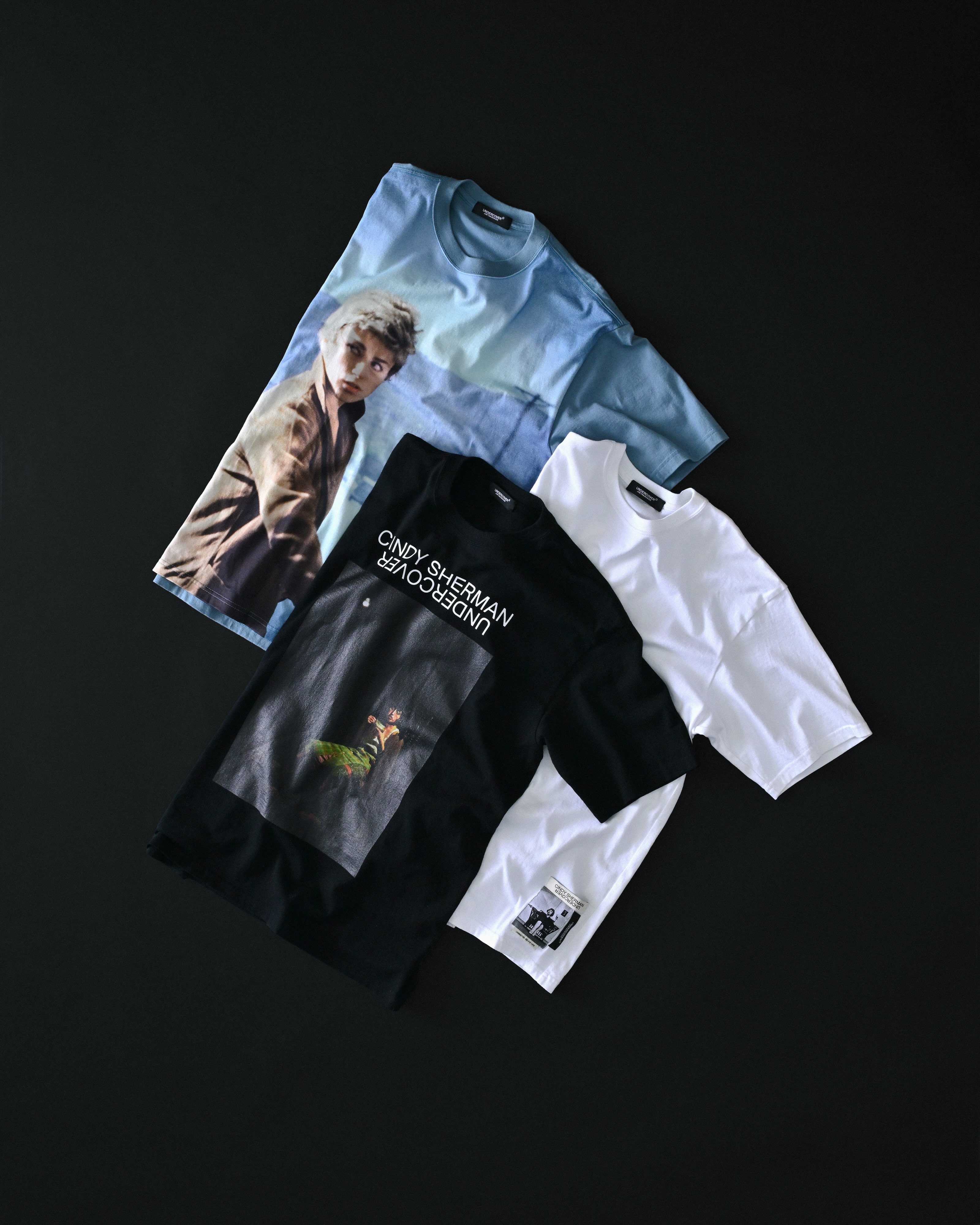 UNDERCOVER AW26 100% KHAOTIQUE NOIR menswear featuring Cindy Sherman self portrait jacquard patches and photo print tees