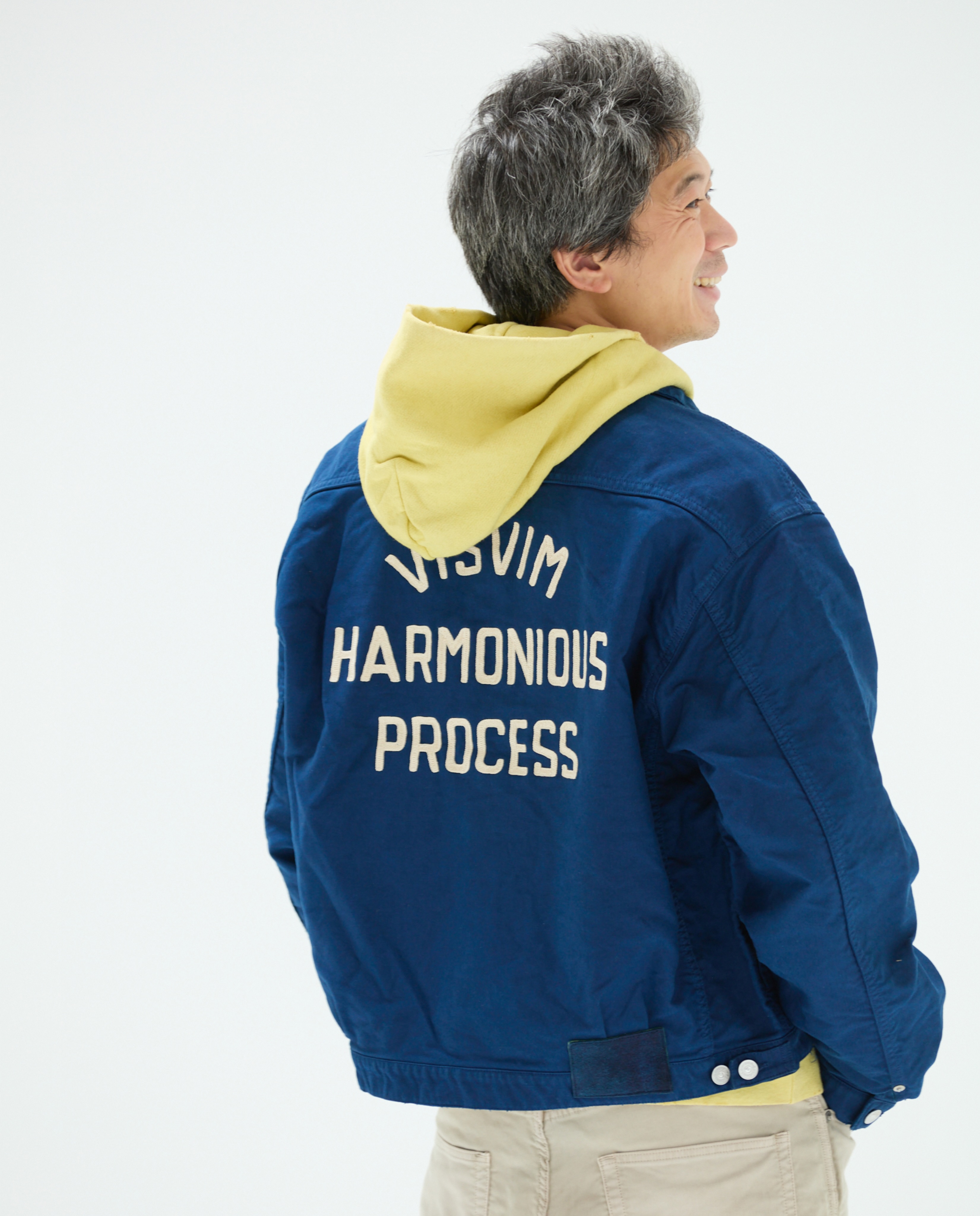 Visvim garments and natural dye materials displayed for the Harmonious Process exhibition.