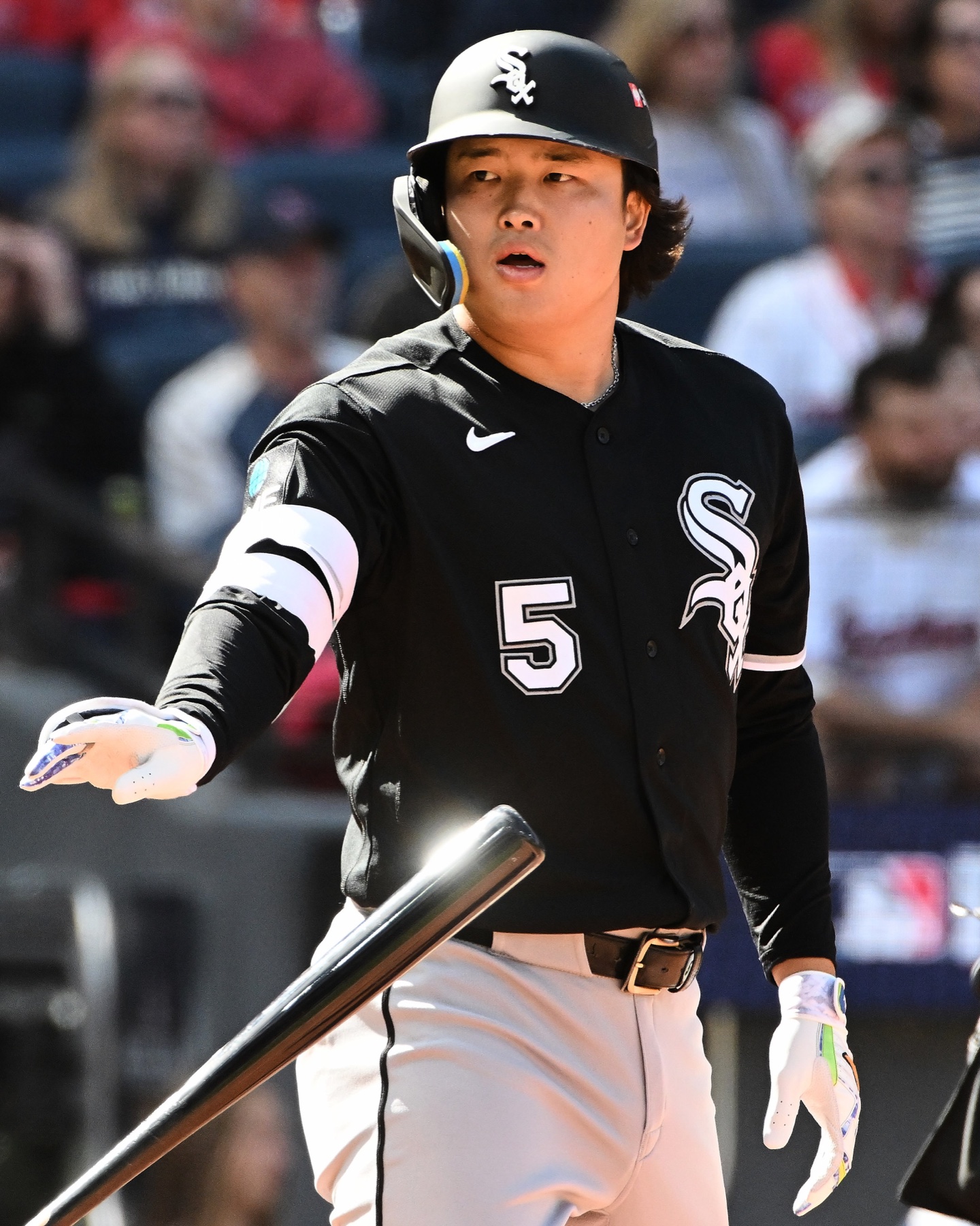 Munetaka Murakami of the Chicago White Sox, wearing No. 5, flips his bat during Game 1 of the ALDS in Cleveland
