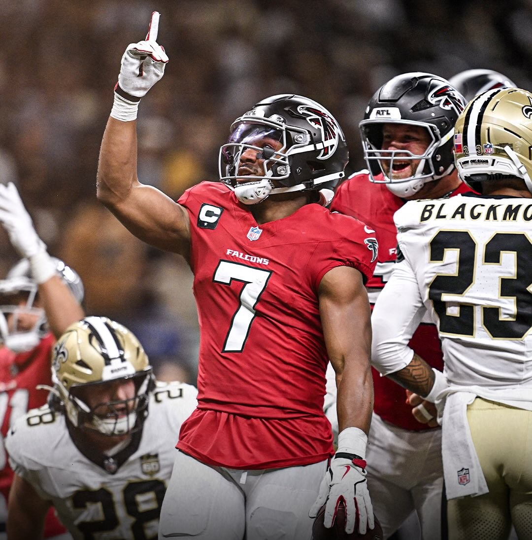 Bijan Robinson of the Atlanta Falcons points upward after a run against the New Orleans Saints on Monday night